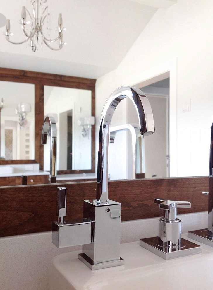 Image of Luxury bathroom sink with modern faucet and soap dispenser, part of KHD Homes' interior design and construction.