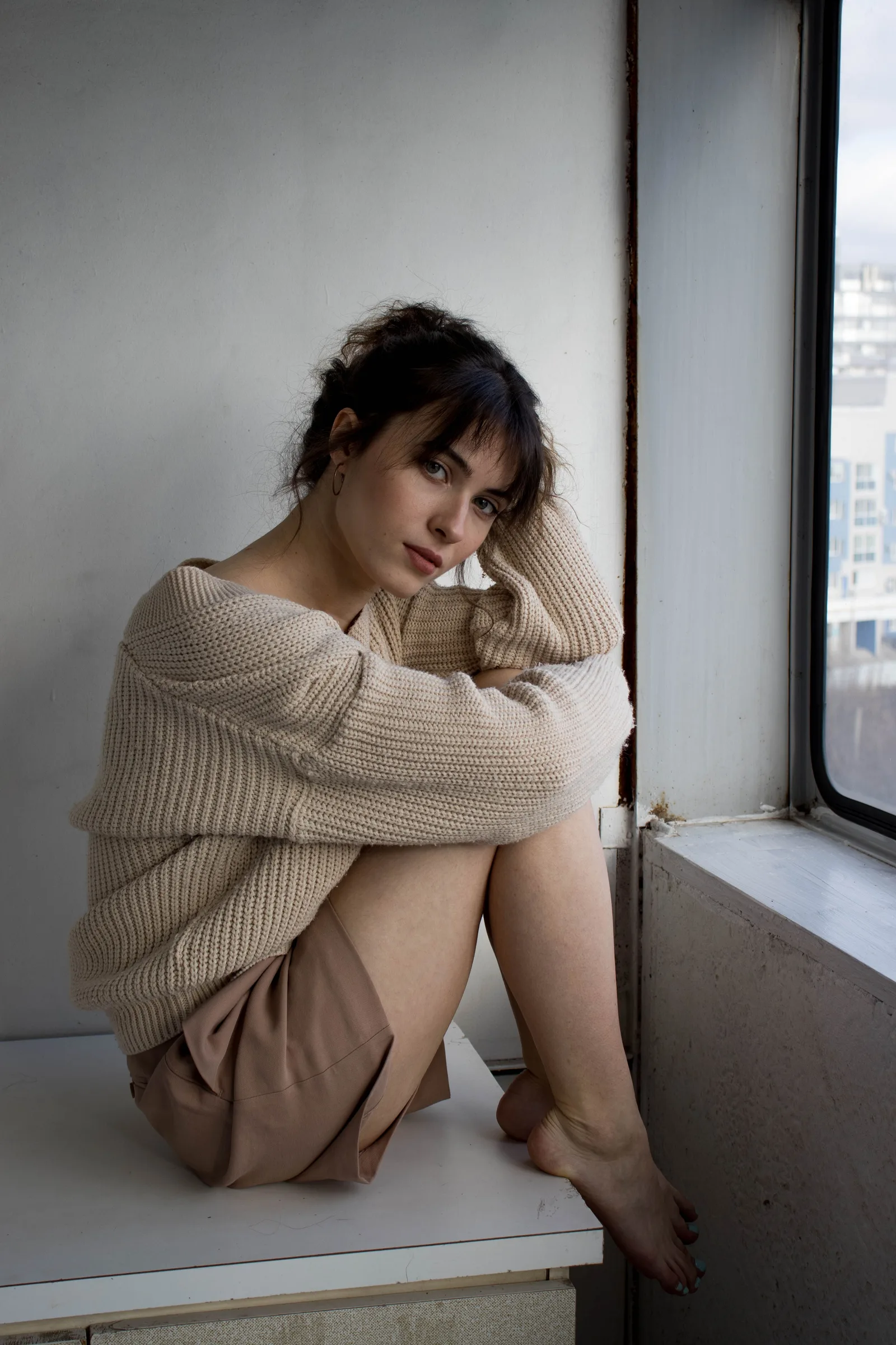 Sienna off duty by a window