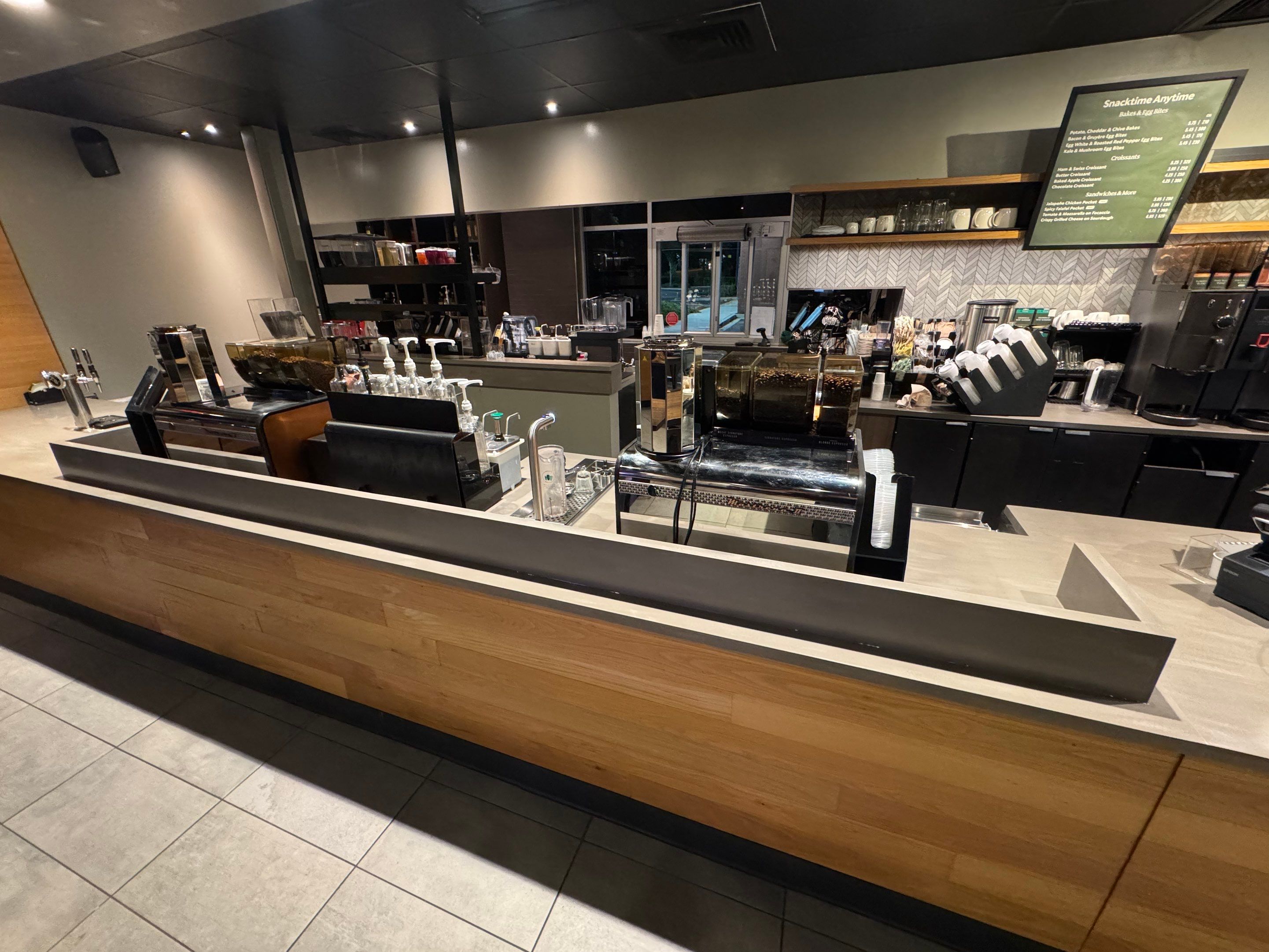 Starbucks countertop replacement showing newly installed surface with reinforced supports and clean edges around espresso and syrup stations.