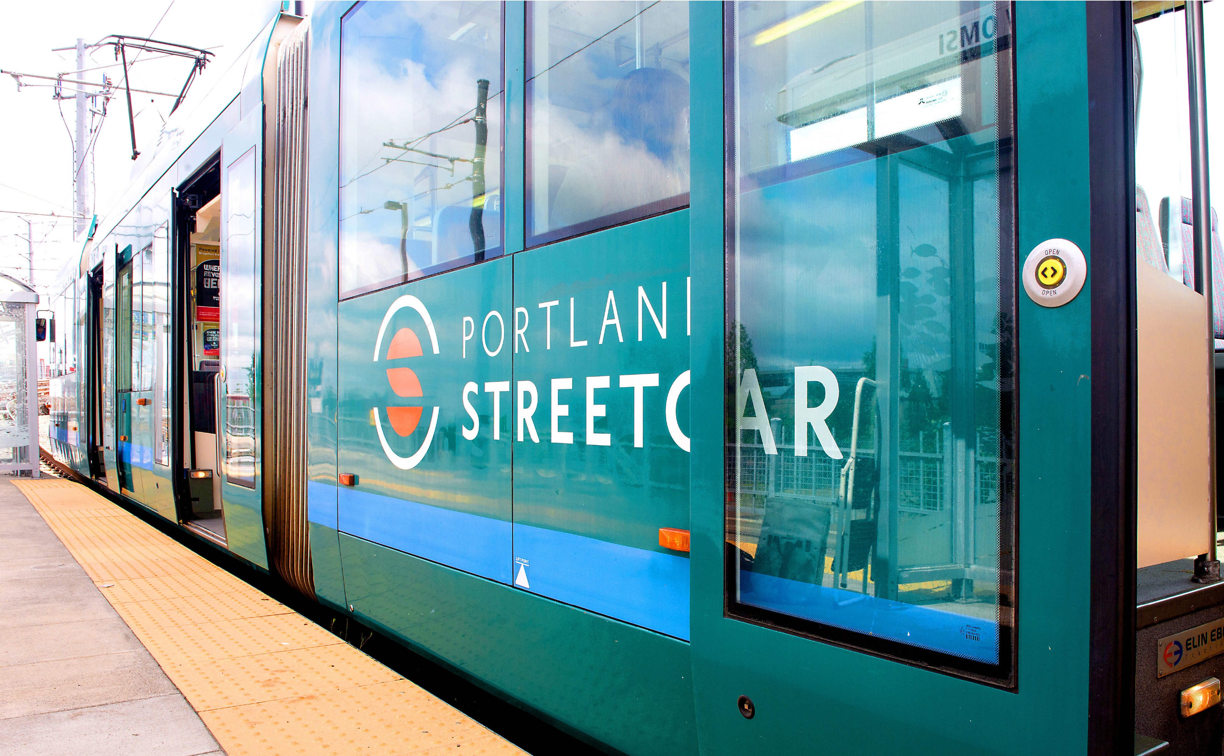 vehicle wrap brand design for portland streetcar