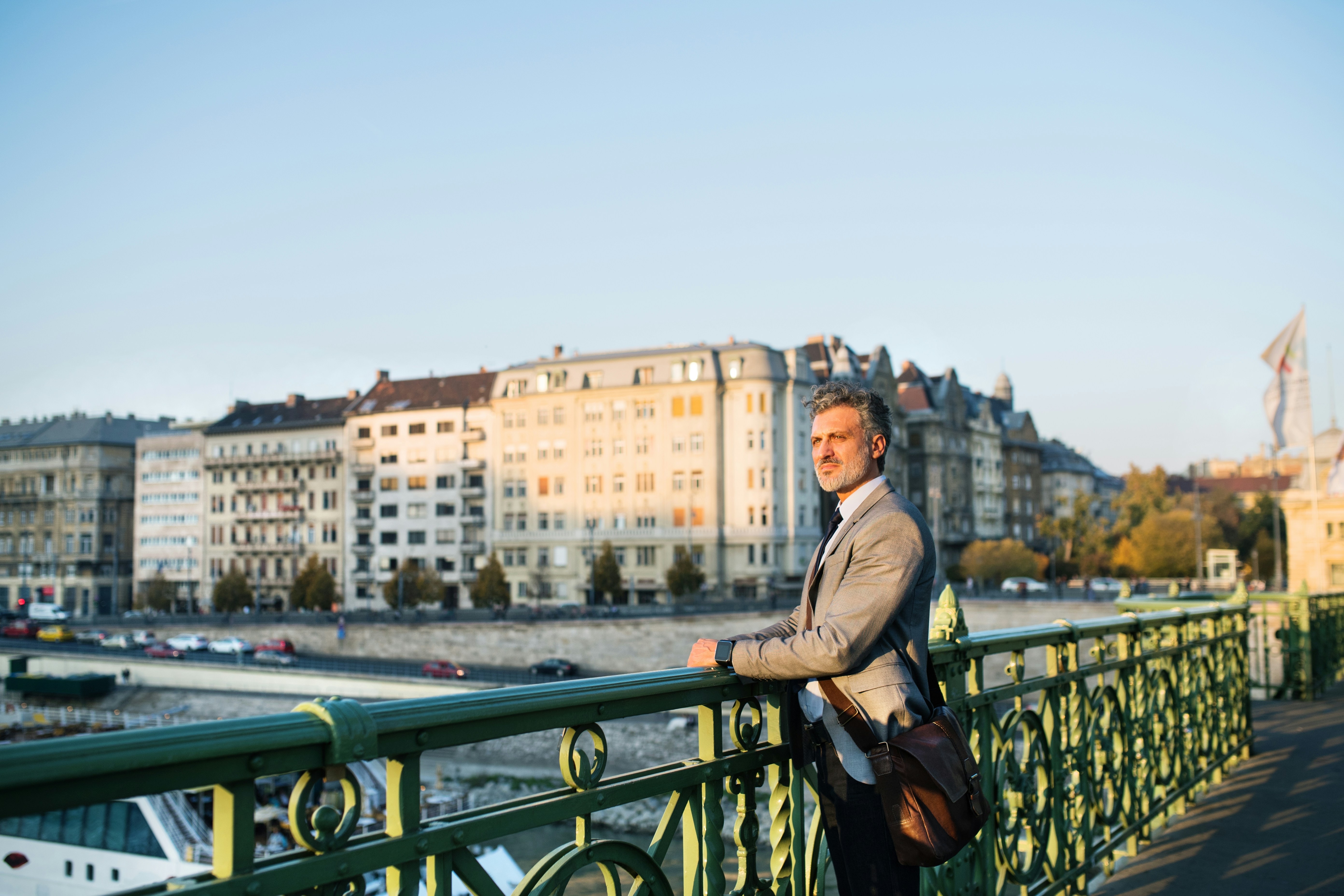Man Standing on Bridge
