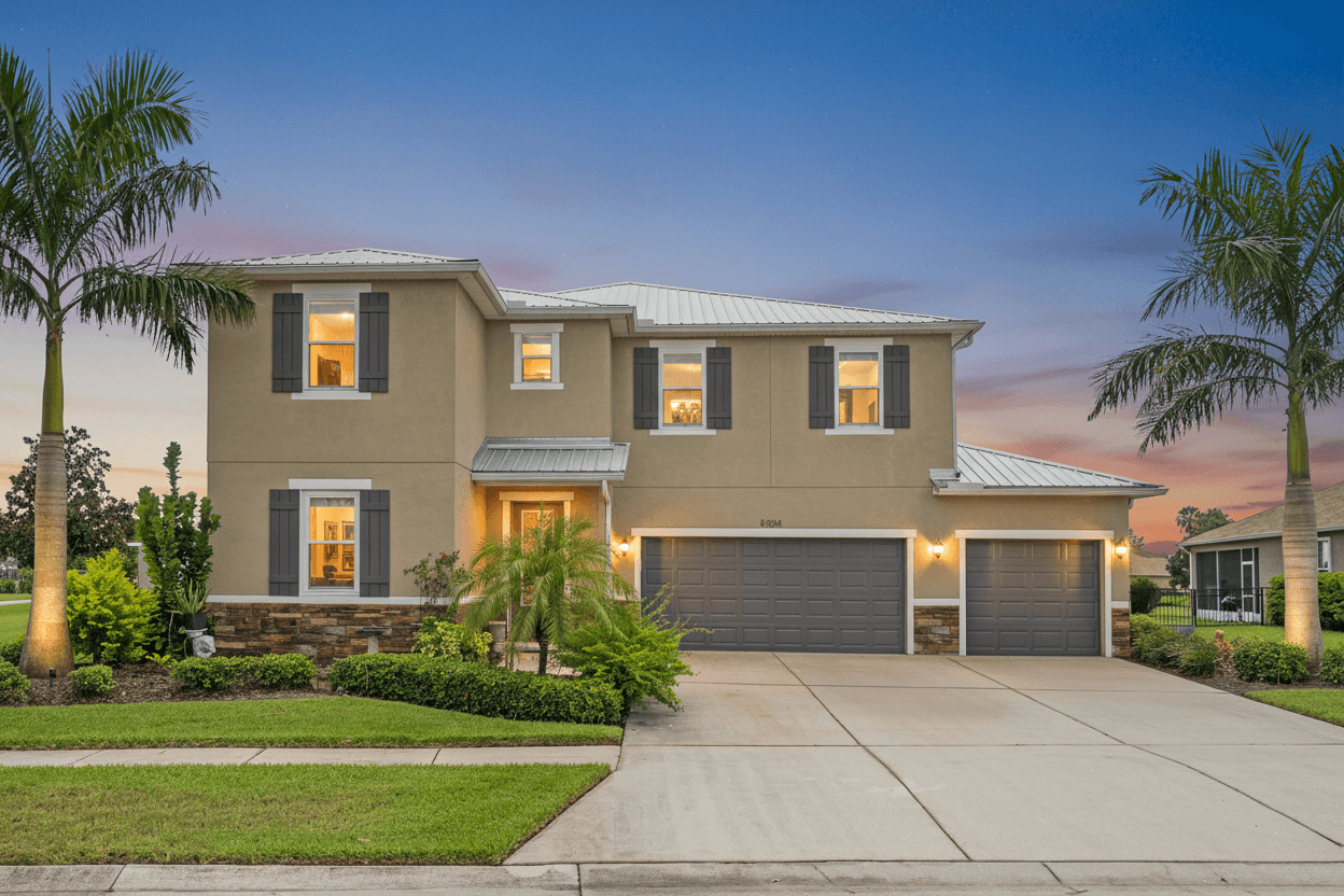 Two-story Apollo Beach home with three-car garage, palm trees and landscaped yard, enhanced with virtual twilight