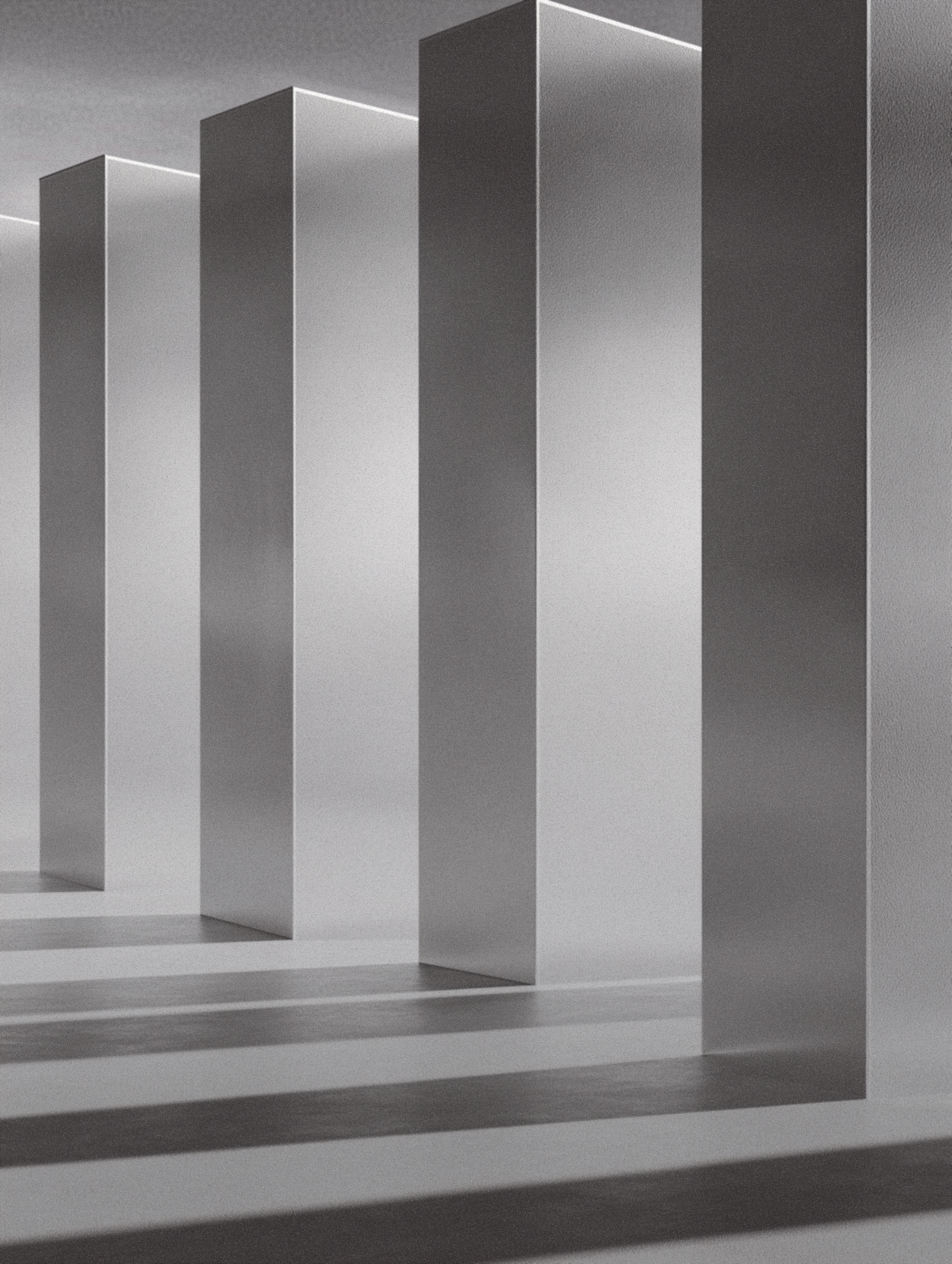 Monochrome concrete portals casting long shadows in a minimal architectural scene