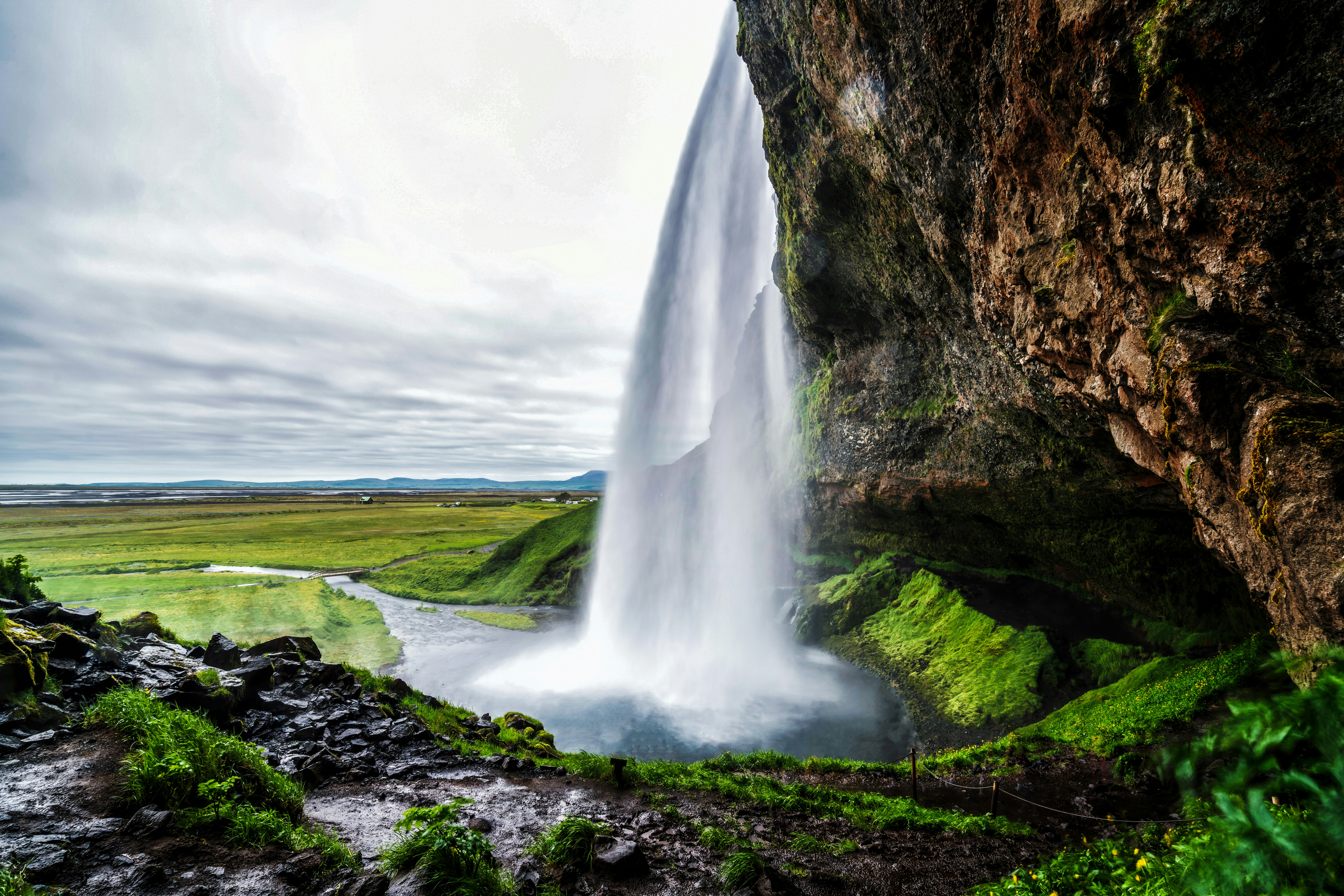 Path leading behind Seljalandsfoss Waterfall in South Iceland.
