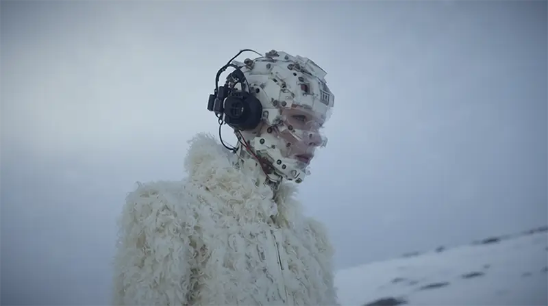 alien lady wallks in the snow on alien planet