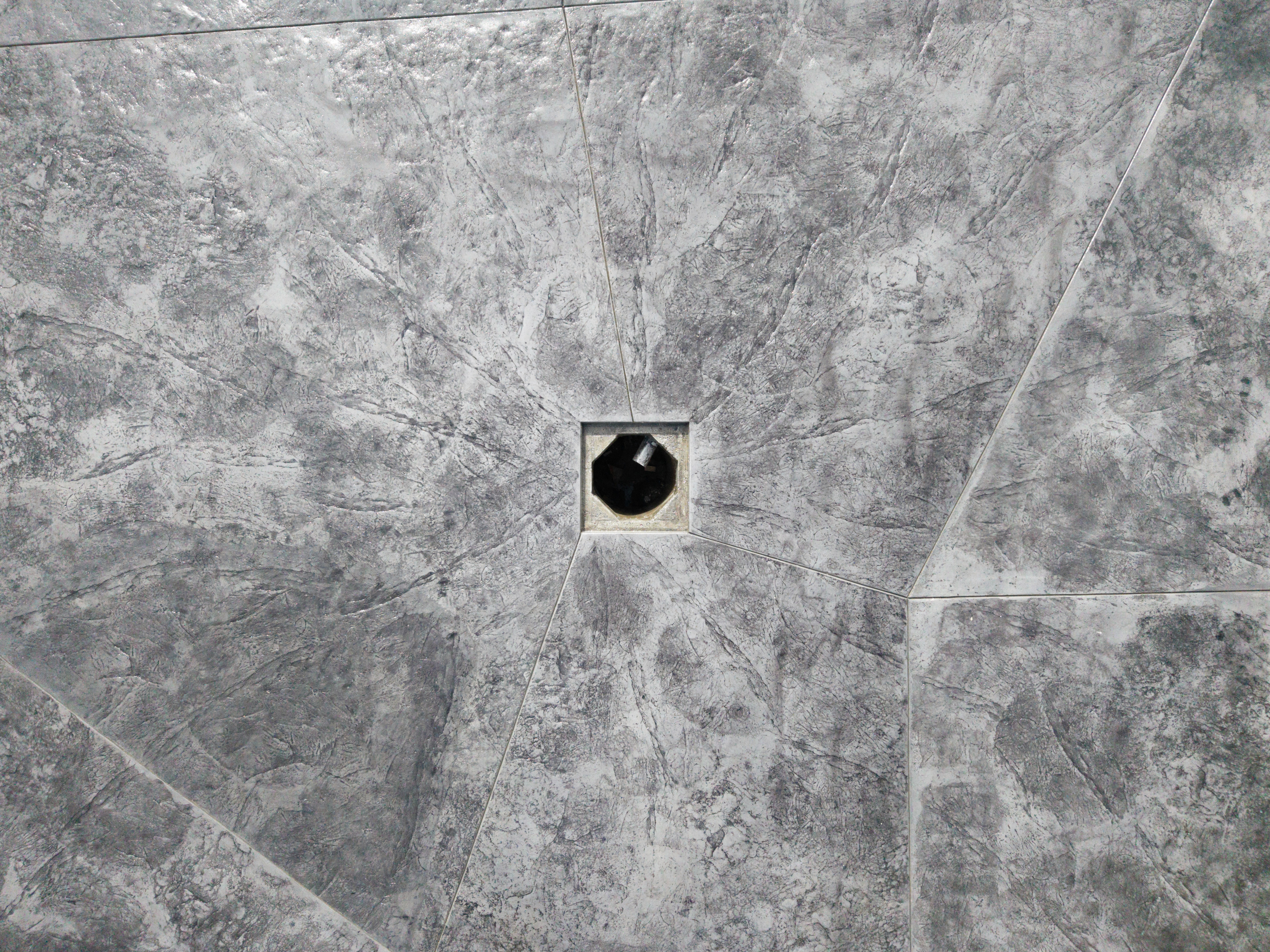 Streetside billboard with flyposters of the Batch.Works brand and illustrations