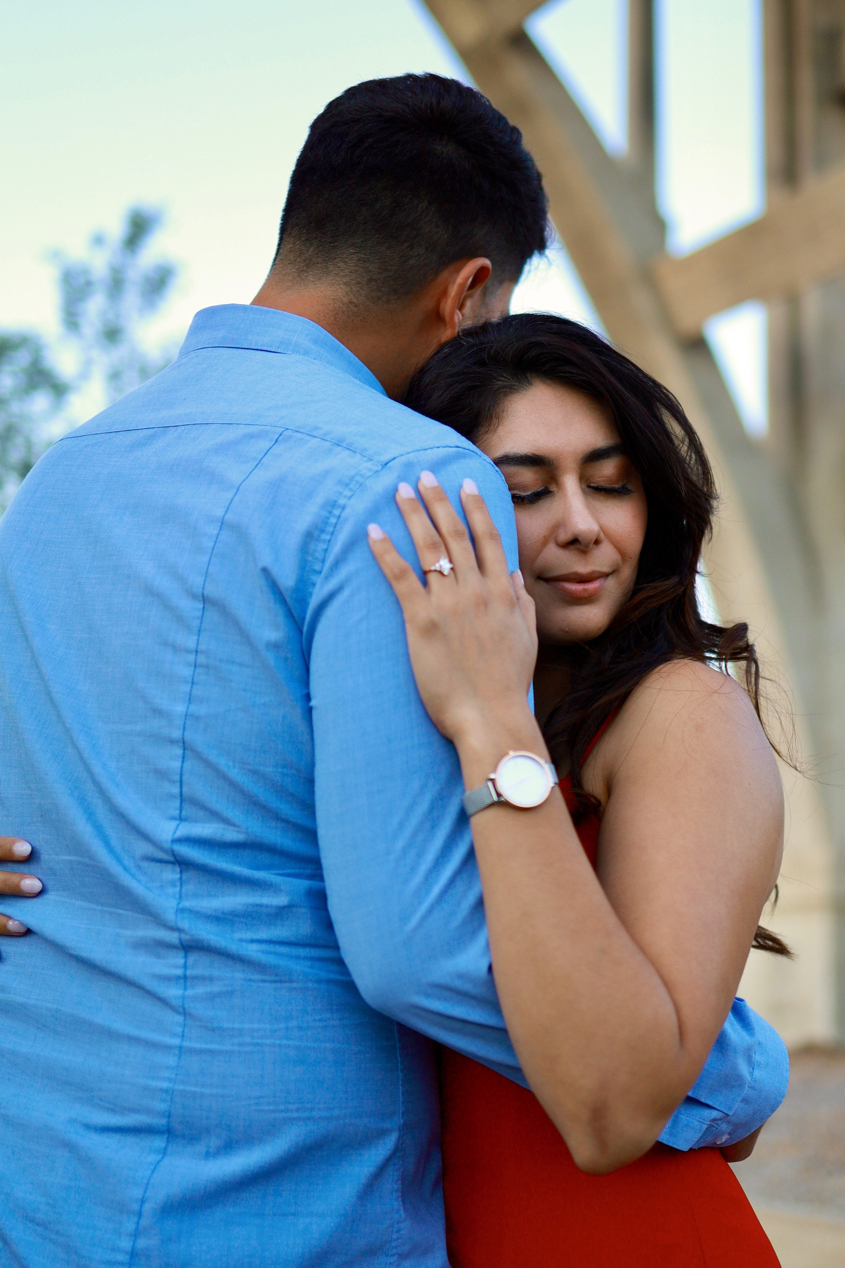Woman sitting at the wooden peice around the lake and doing meditation
