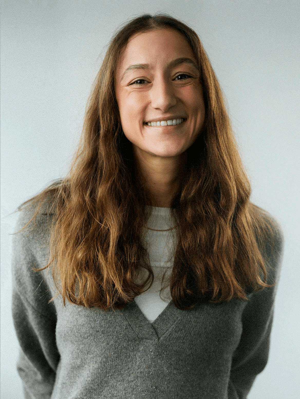 man standing beside wall