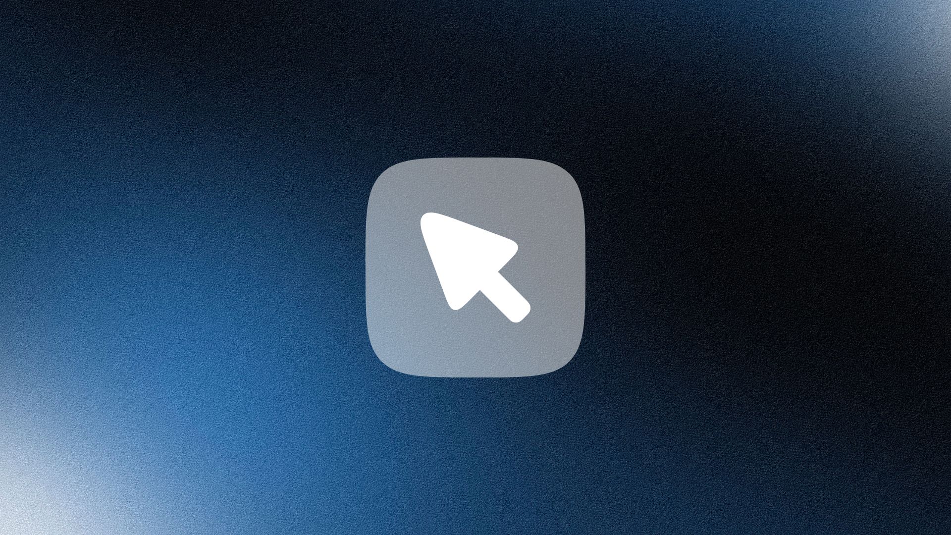 Man wearing a beige cap and dark shirt working on a laptop at a wooden desk with a plant in the background.