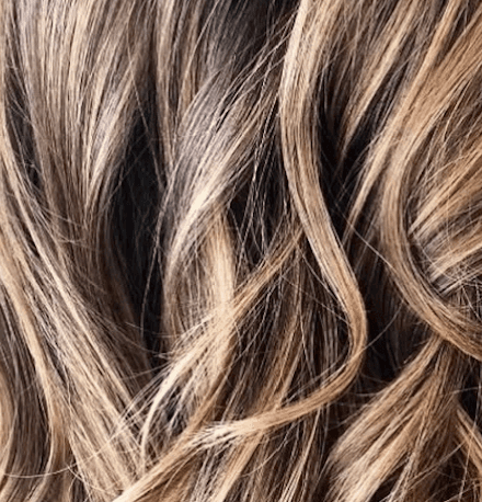 Magnified warm blonde with caramel tones, Modern Blonding at Del Sol Hair Studio Huntington Beach