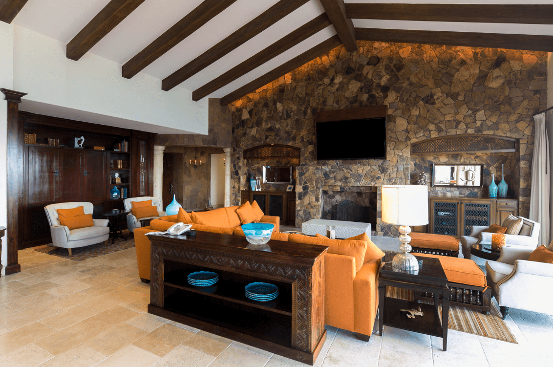 Interior lounge with stone fireplace at La Estancia Penthouse 3603.
