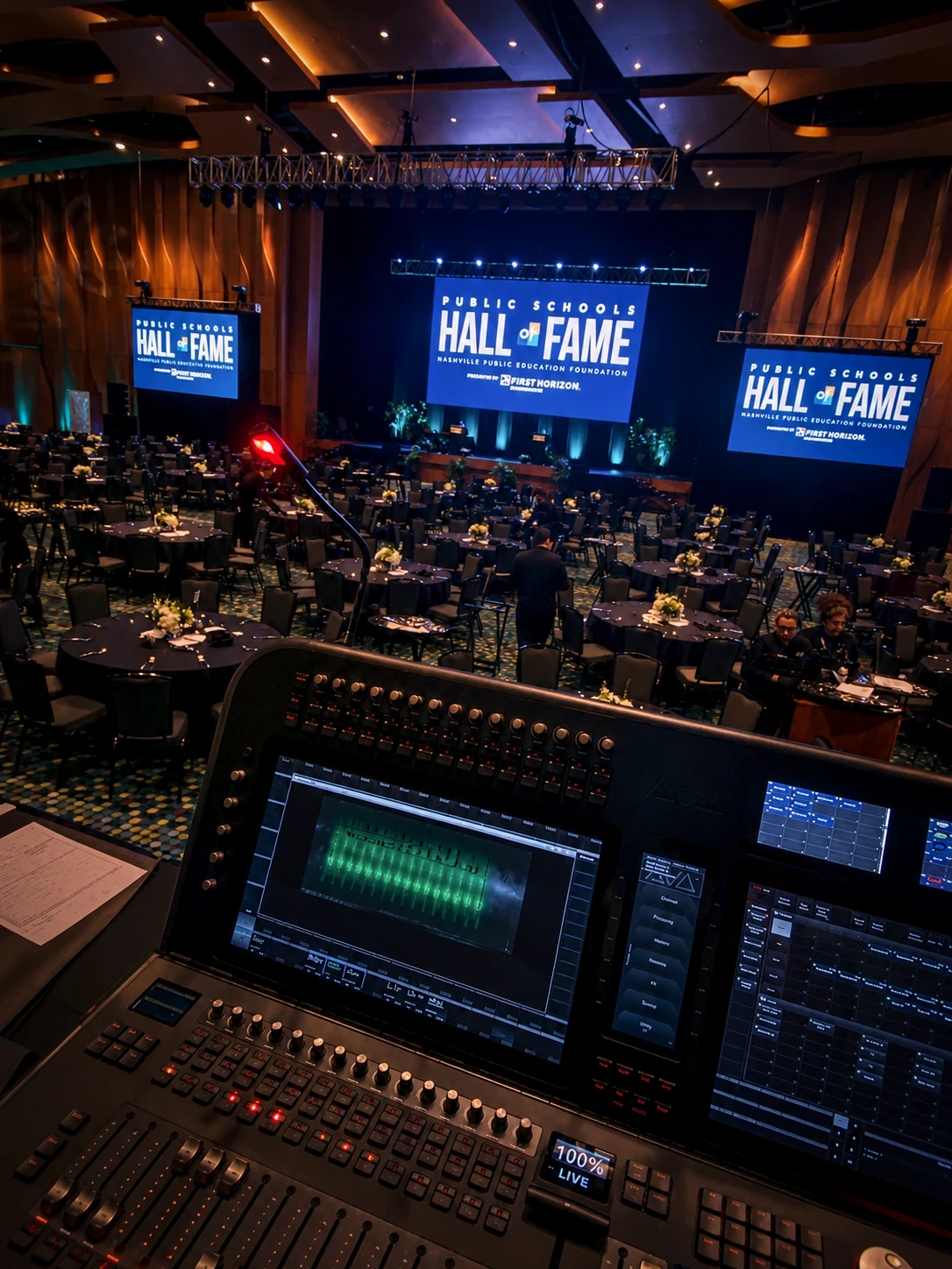 Front-of-house audio mixing console facing the Hall of Fame stage at the Nashville gala — audio production by UpLight Technologies