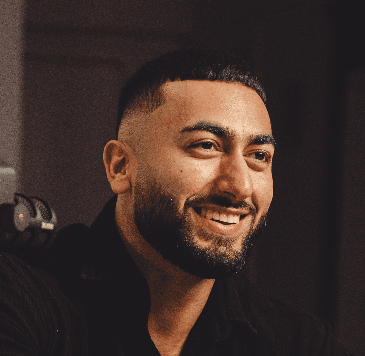 Smiling portrait of Sohil Elyas, fitness coach and founder of Sohil Coaching brand identity project.