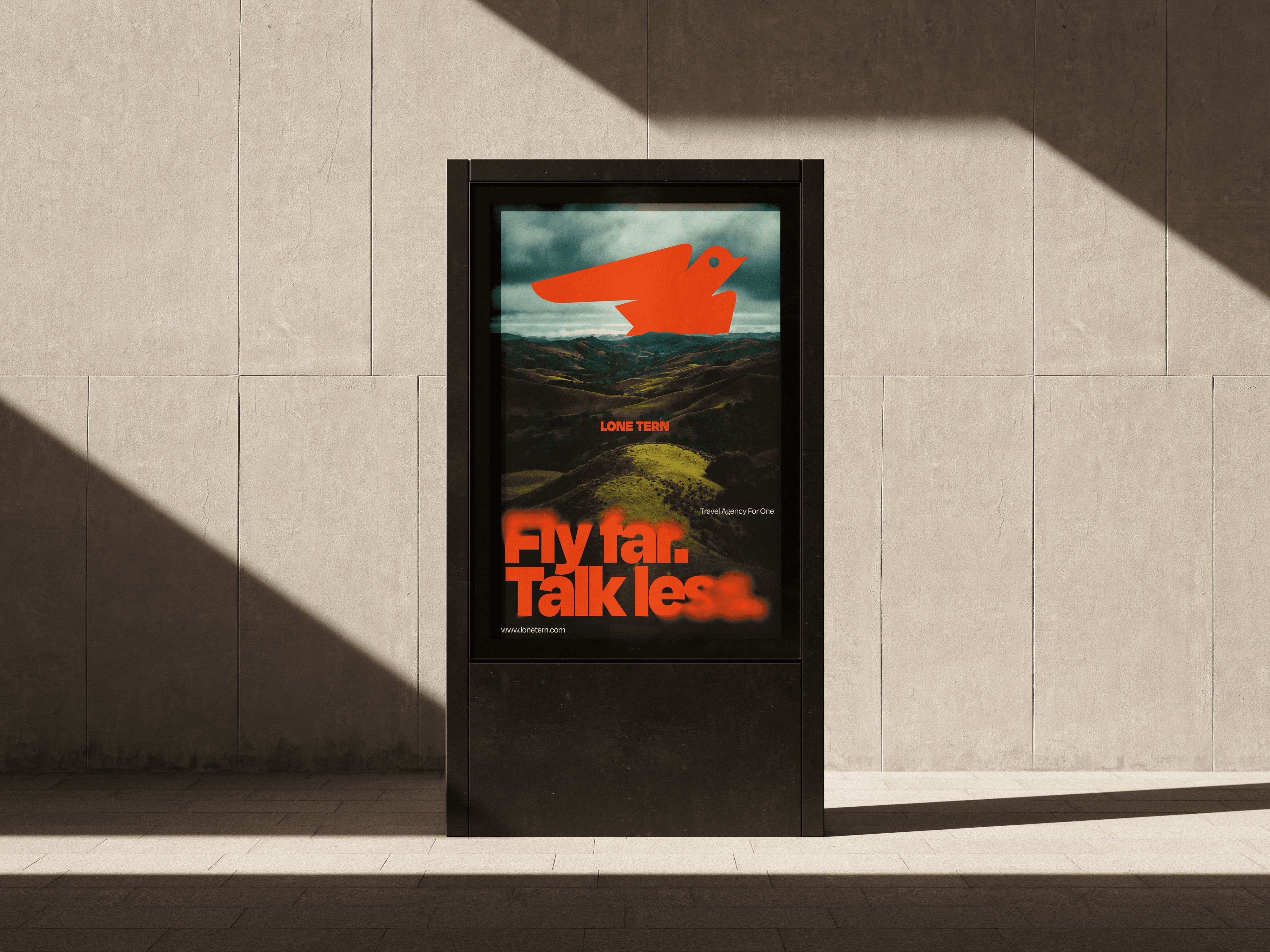 City light poster “Fly far. Talk less.” on a concrete wall, and the “Packed For One” poster in a street frame among trees.