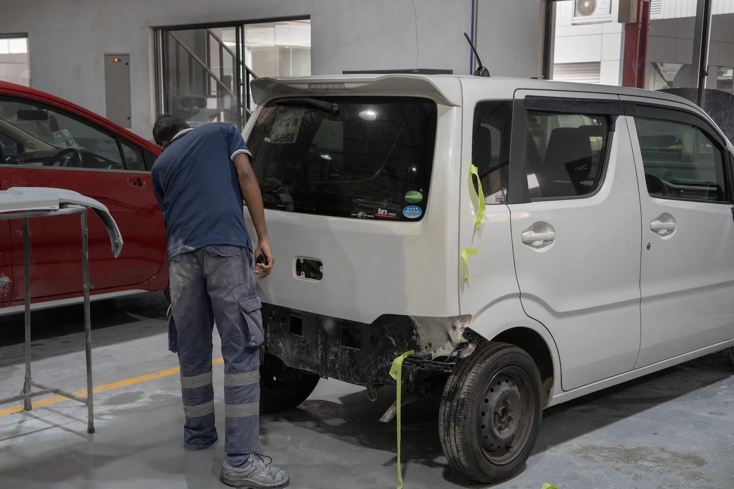 Mechanic at Ideal reparing car