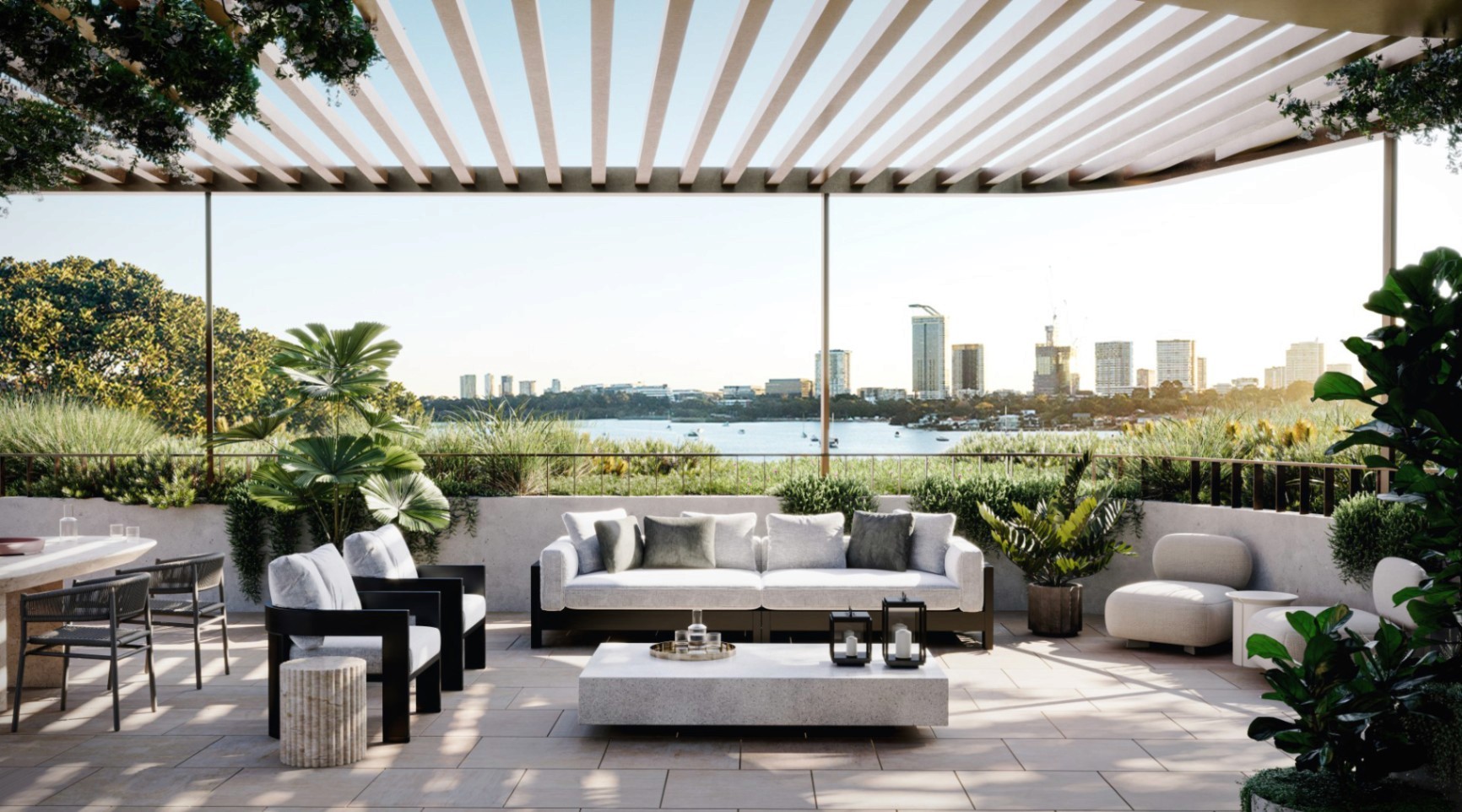 Landscaped rooftop terrace with outdoor lounge seating overlooking the harbour