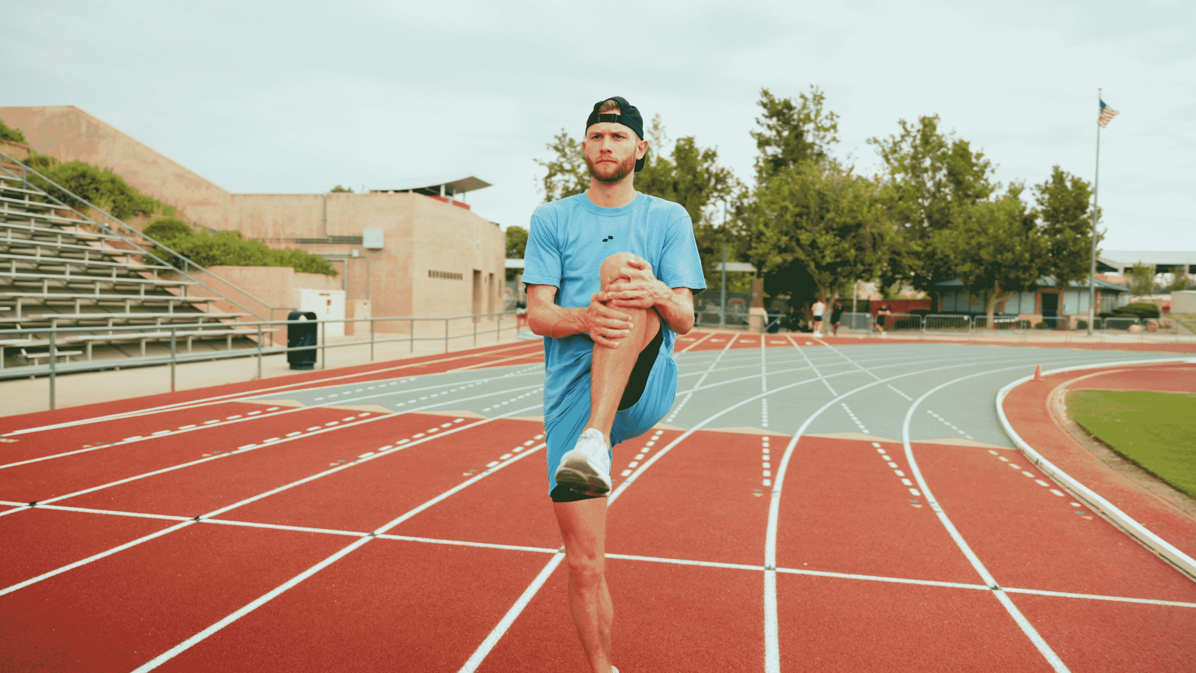 Man Stretching - Standing Quad Stretch