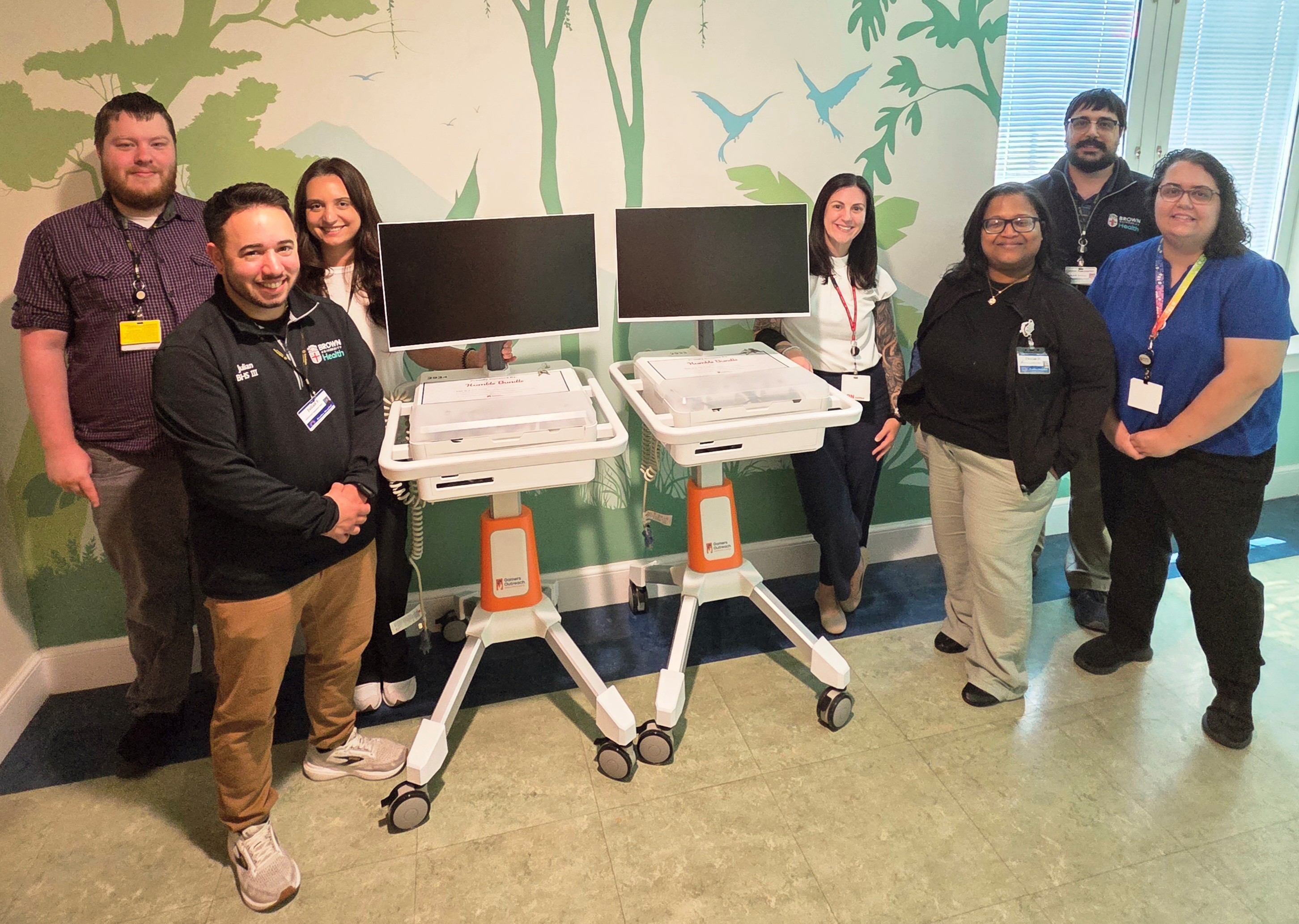 The staff at Bradley Hospital in Riverside, CA, pose with two GO Karts donated by Humble.