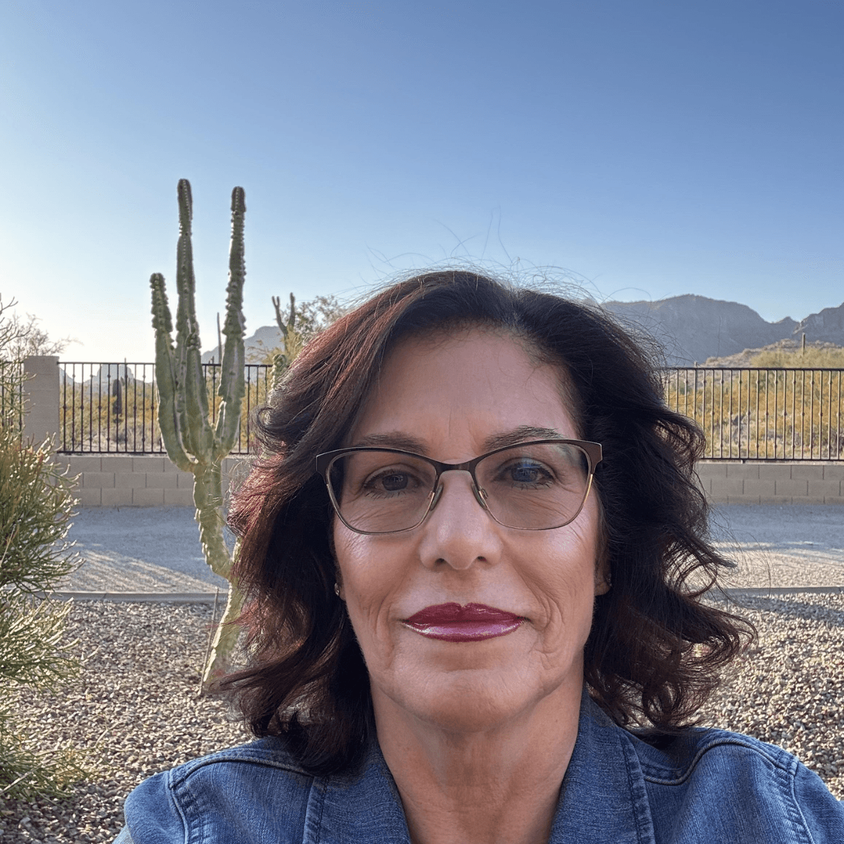 a man with a goatee smiles at the camera