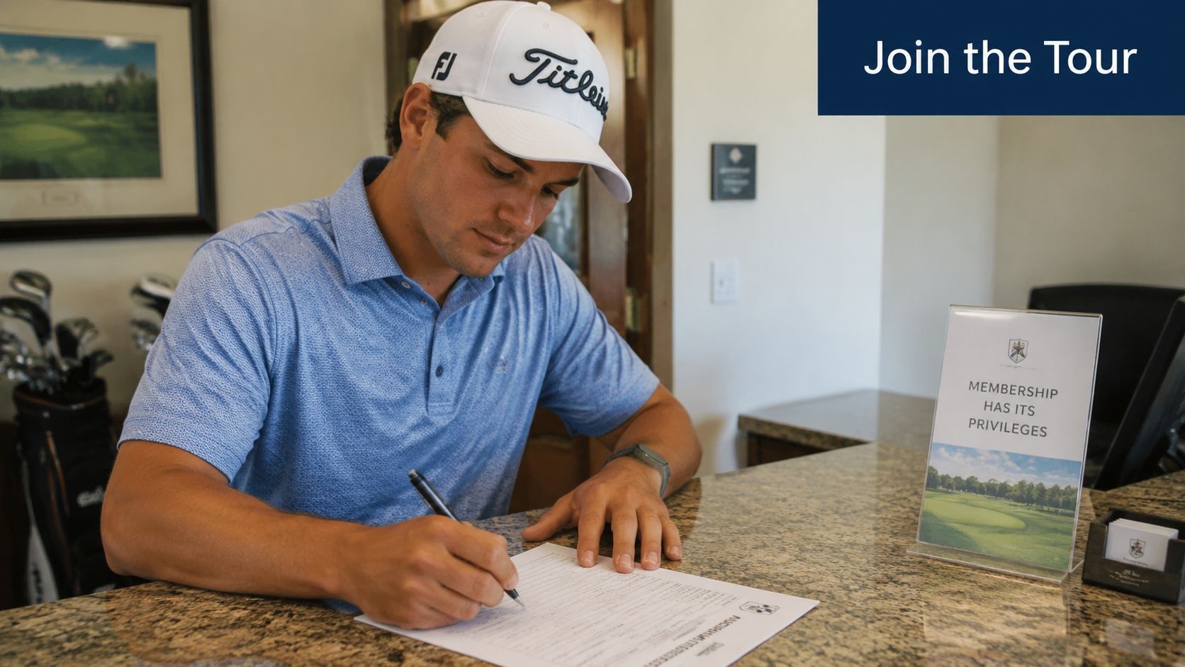 A man wearing a golf hat signing a document at a desk inside a golf clubhouse.
