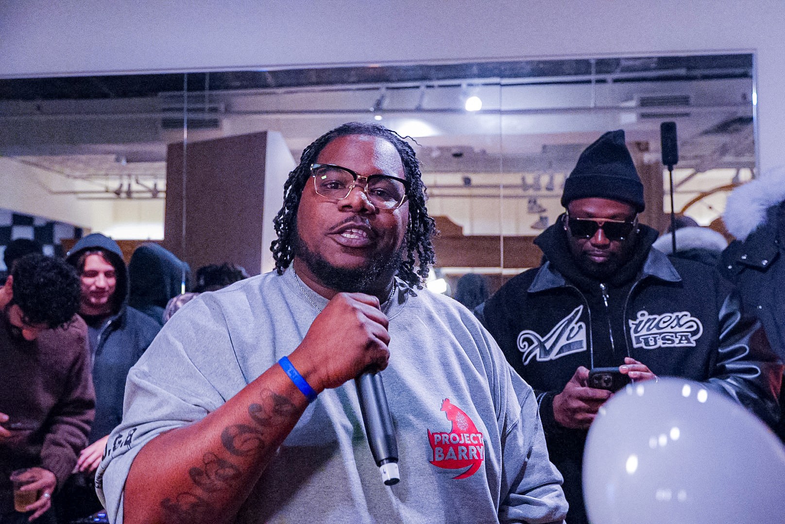 close-up shot of a woman sitting beside red cherries
