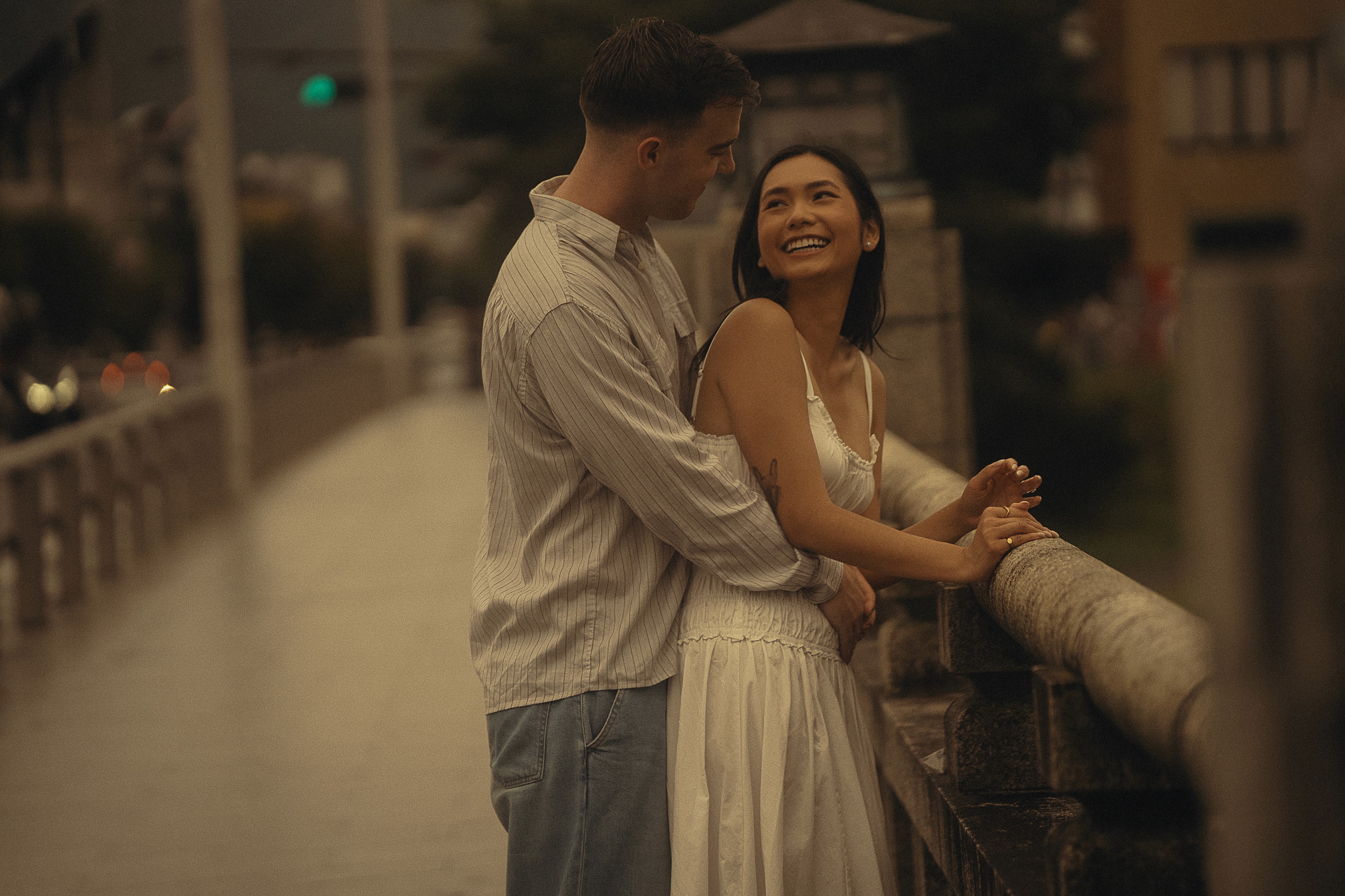 Couple portrait with dog on field