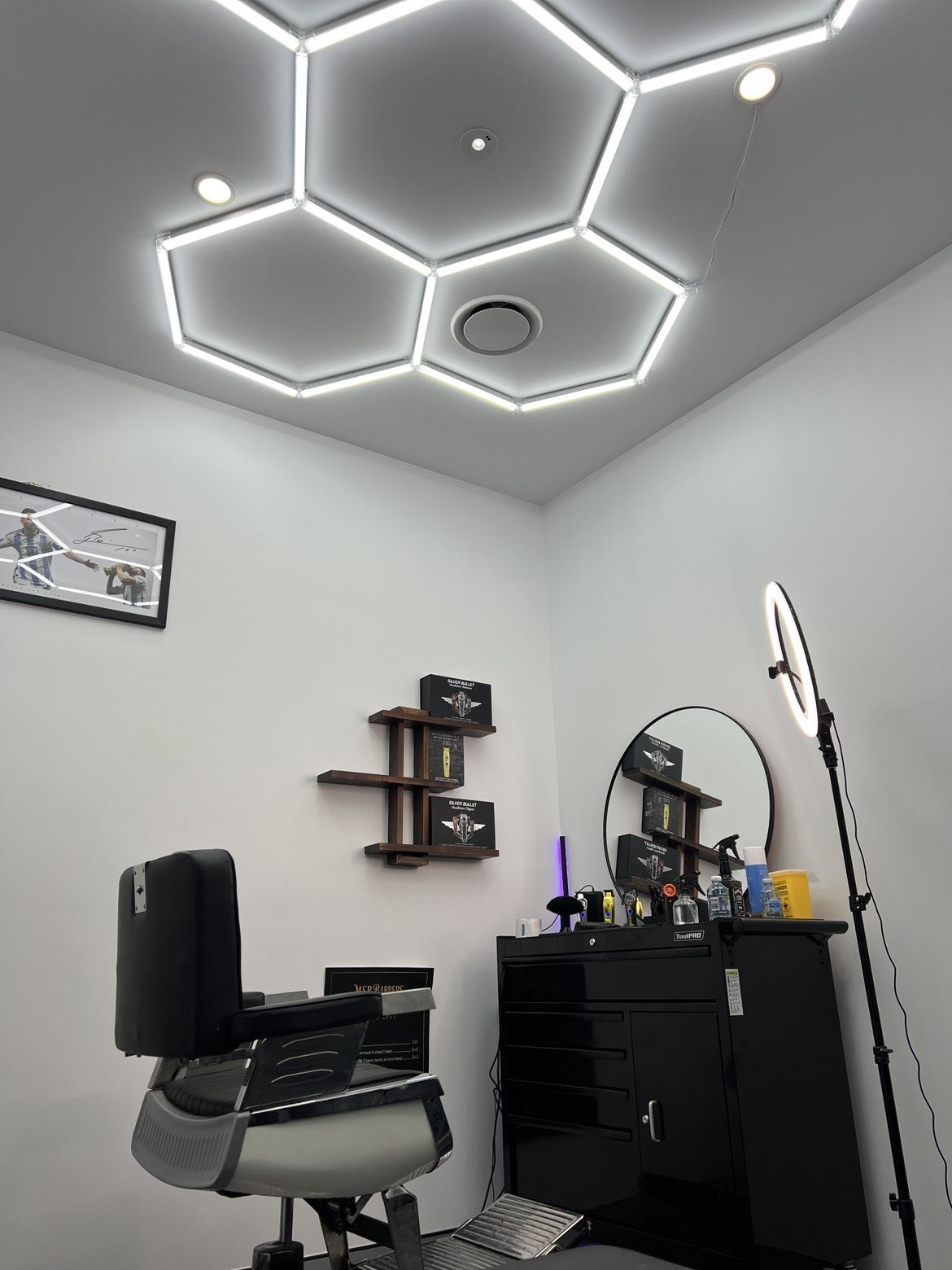 Barber styling a red-bearded man's hair