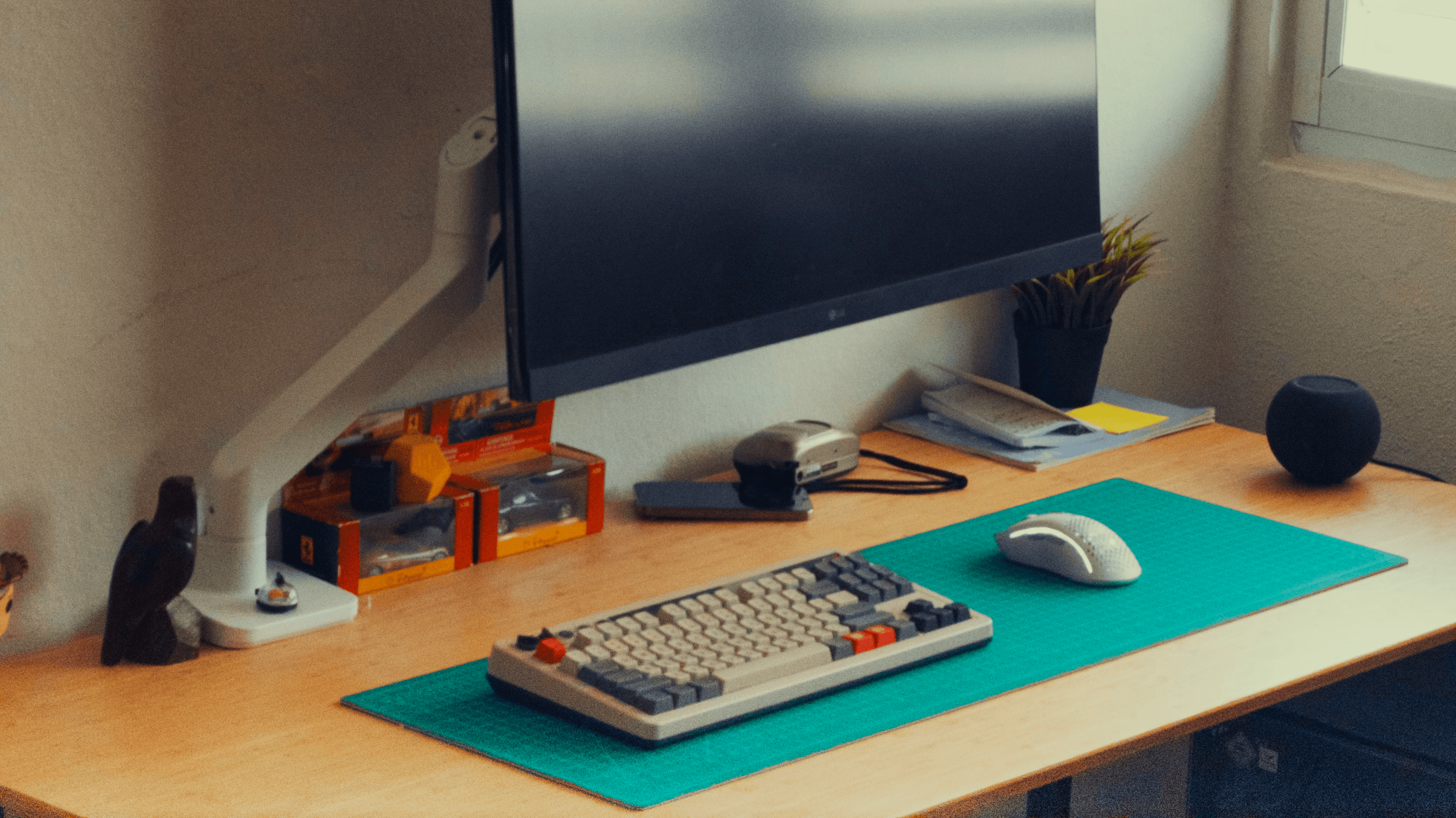 Desk with monitor, laptop, ps5 and pc.