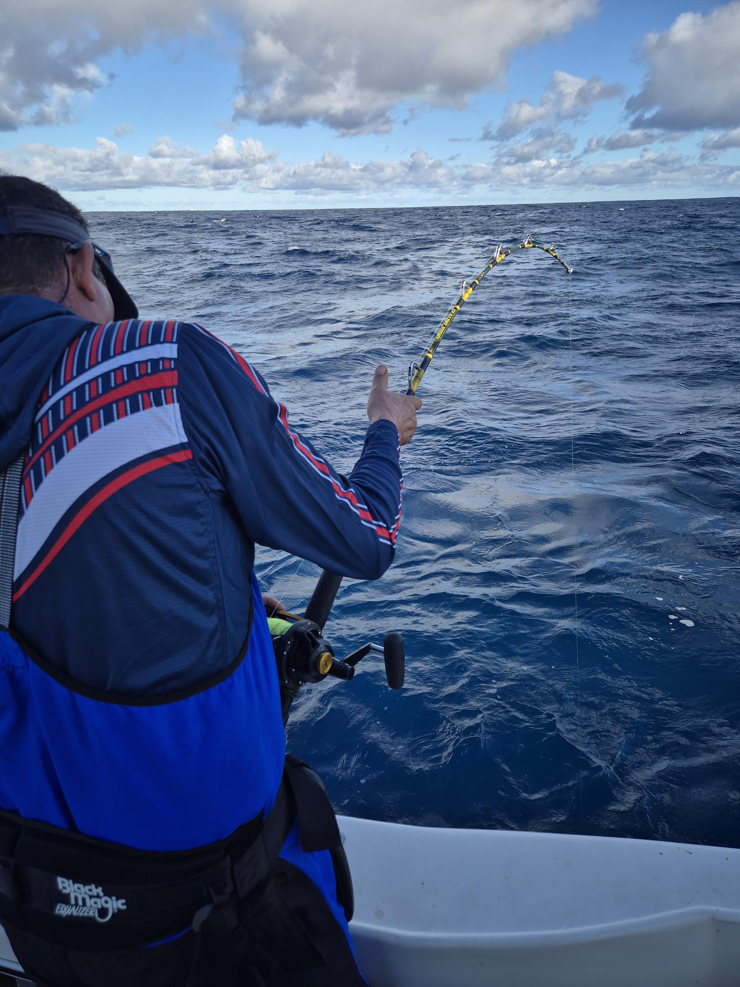 Fishermen celebrating a successful catch on a Salt Safari charter.