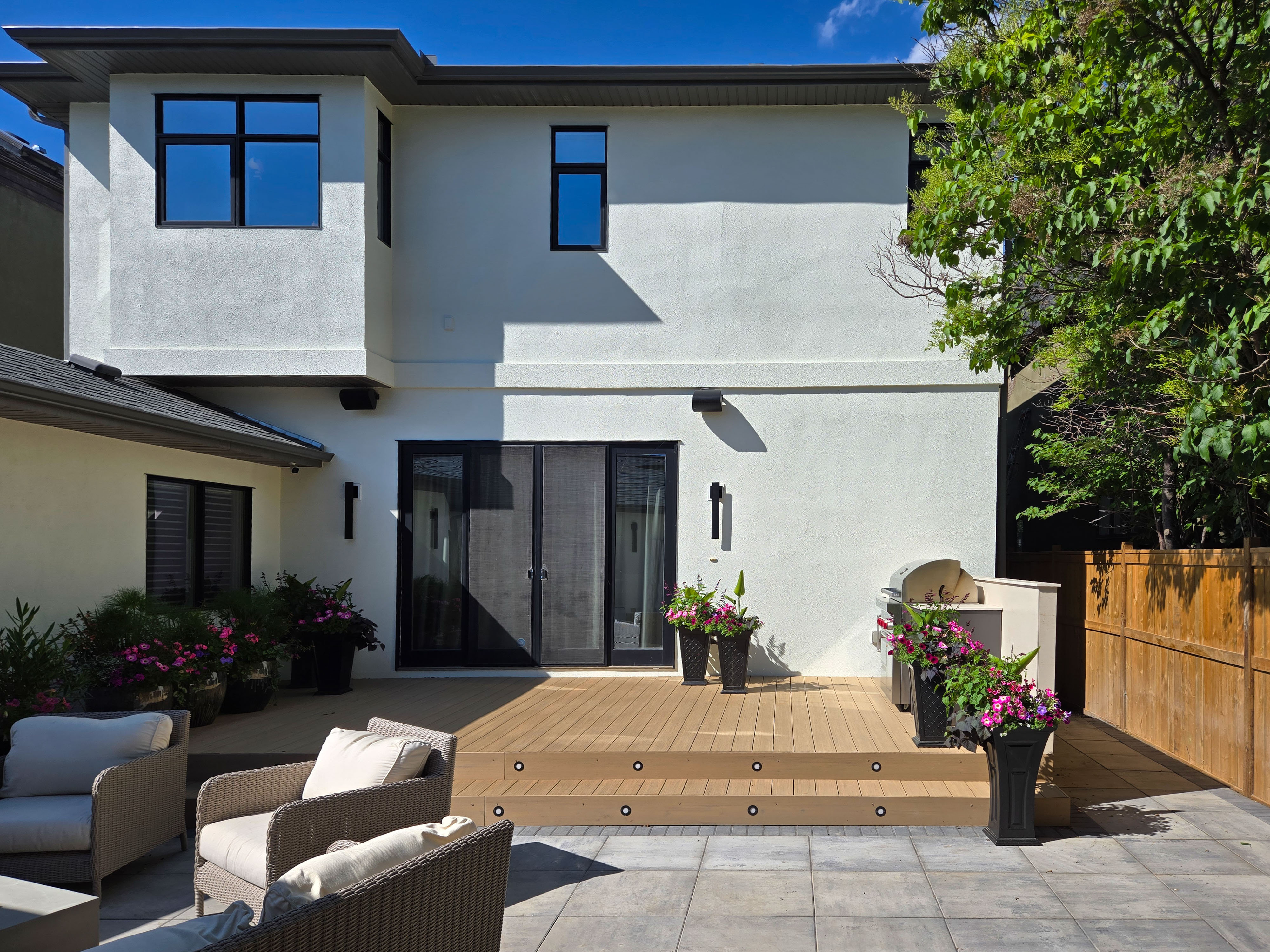 Image of KHD Homes outdoor living space with patio furniture, deck, and modern exterior design elements.