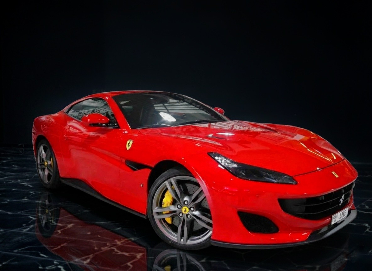 Ferrari Portofino side profile in red, luxury convertible available for rental in Dubai