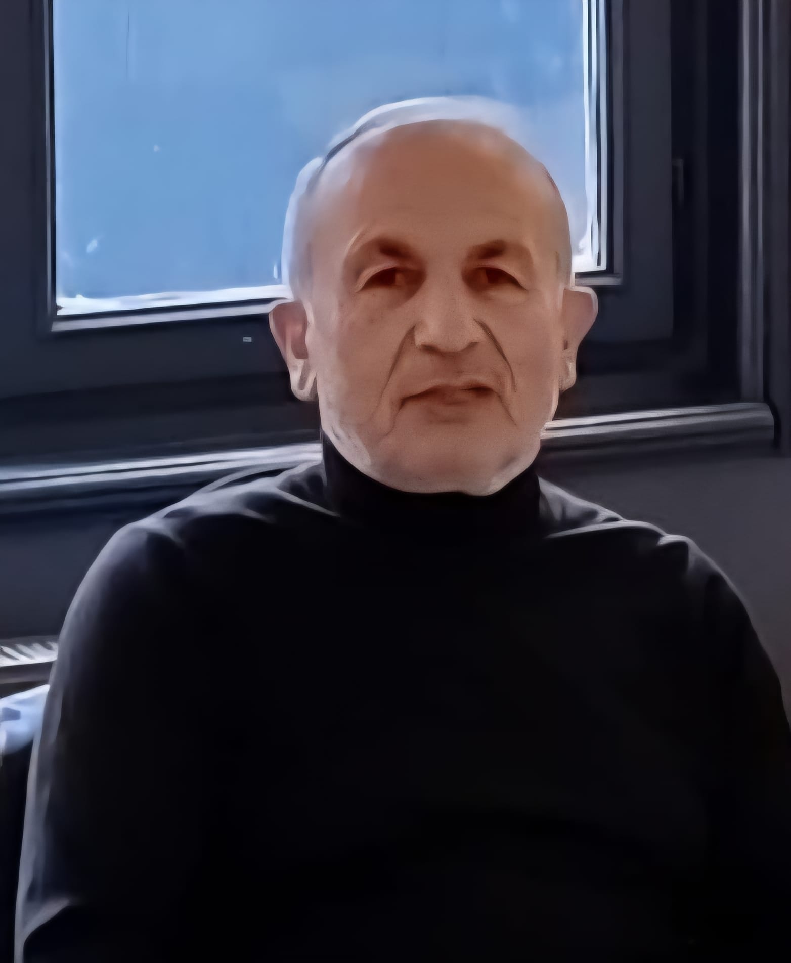 woman in black crew neck t-shirt wearing brown framed eyeglasses standing on rocky shore during