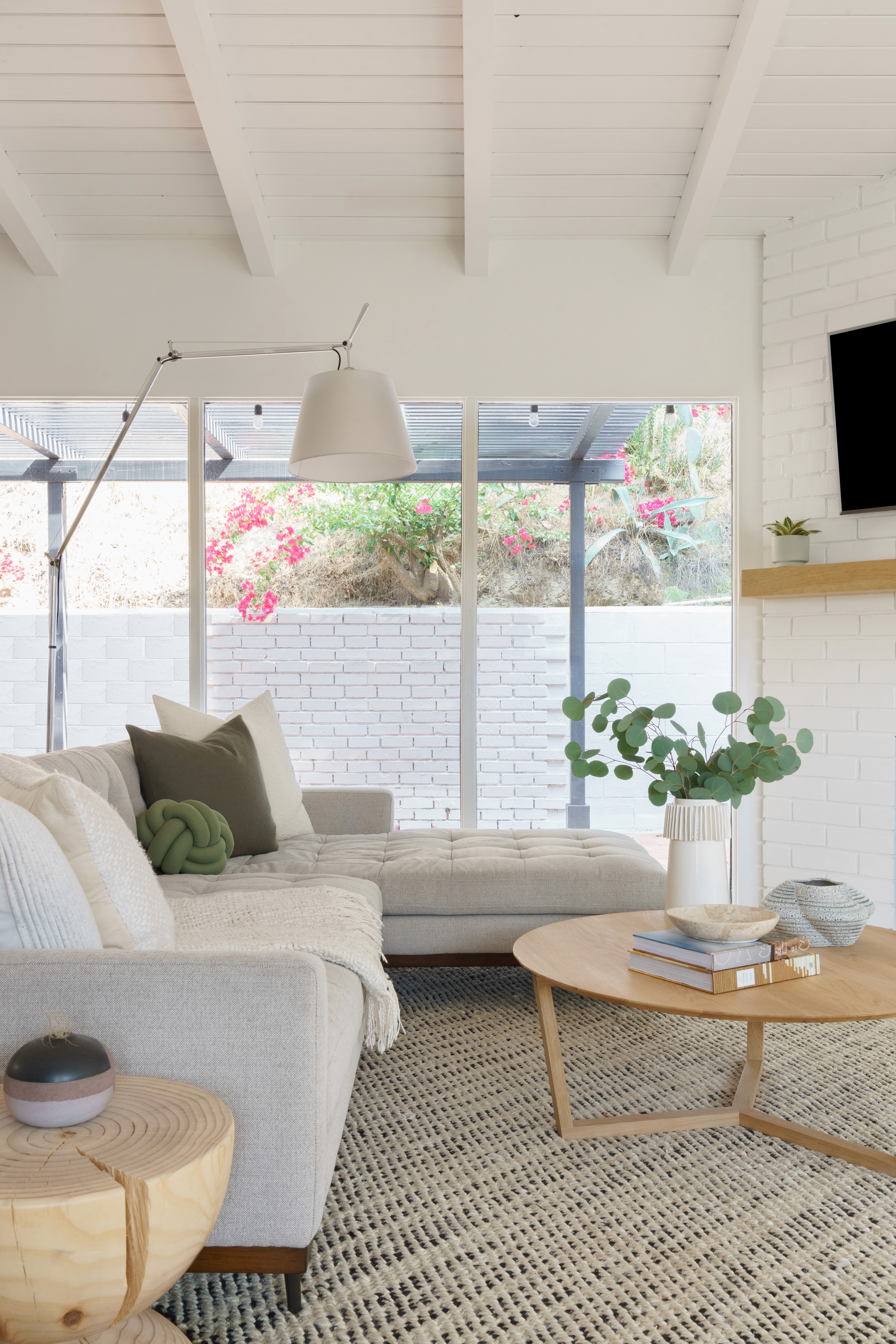 Mid-century living room refresh with a blend of classic design and contemporary comfort  by Ventura & Los Angeles interior designer Jubilee Interiors