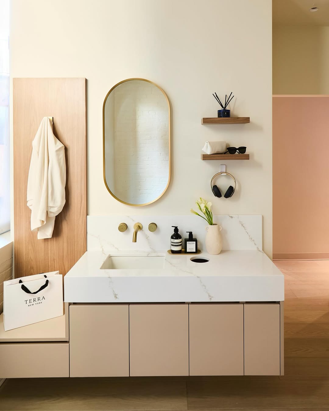 Gift box held in front of BDIOS Dental reception wall with custom dimensional logo signage.