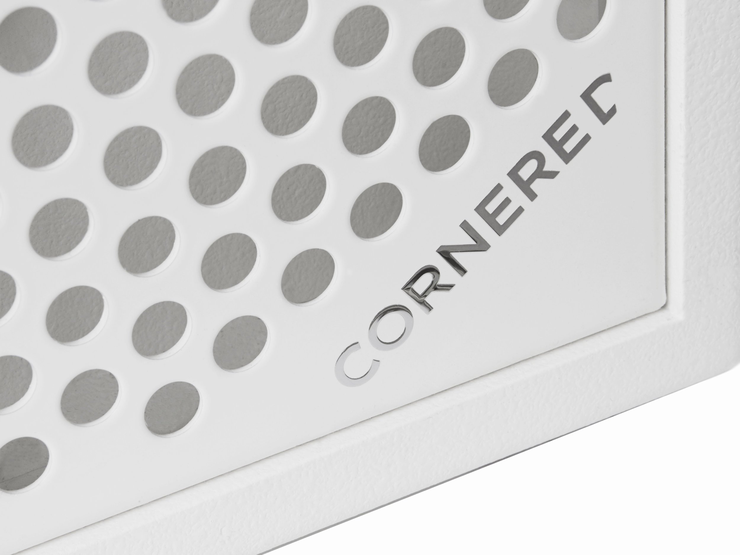 White surface with circular perforations and CORNEREC logo.