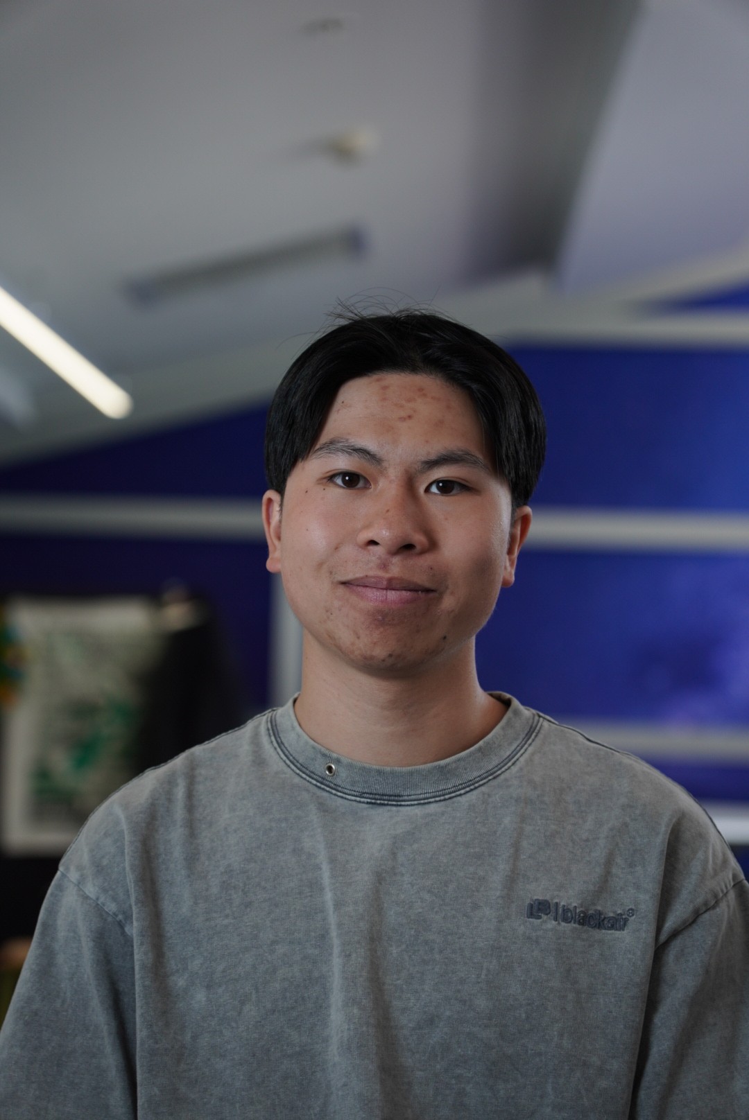 a man with a goatee smiles at the camera