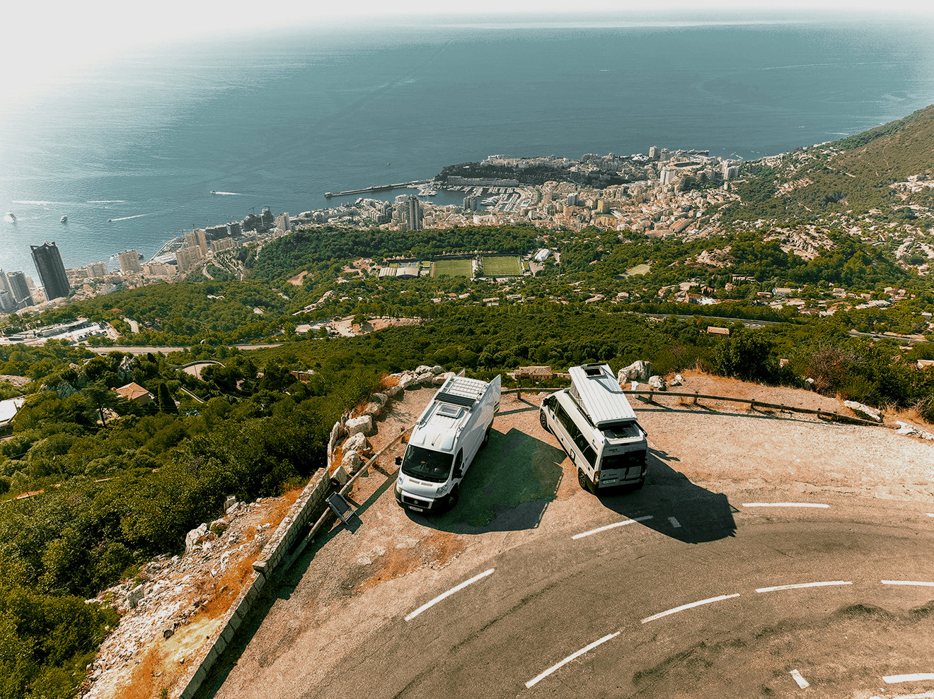 Chef plating a fried chicken sandwich