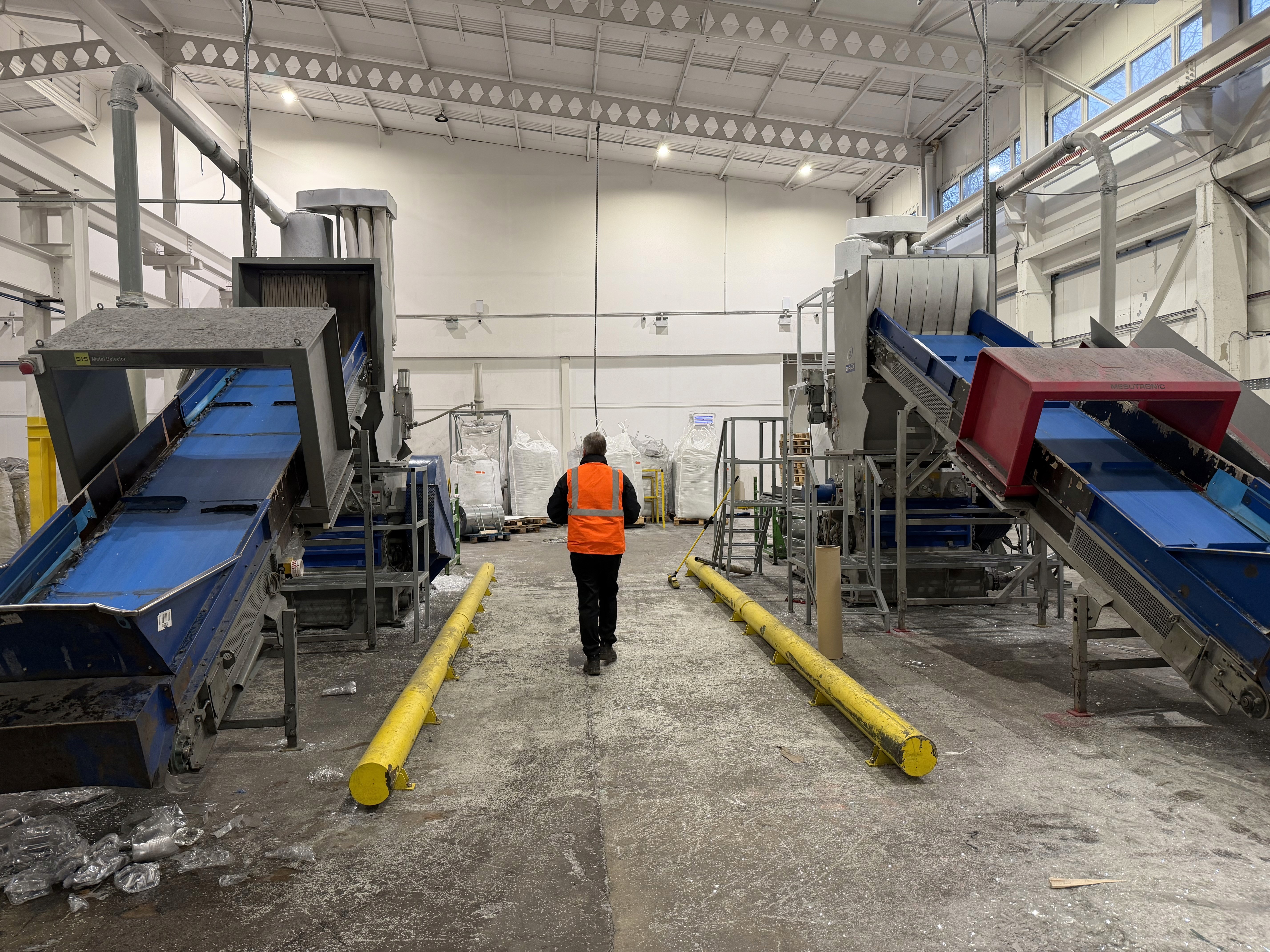 a group of men standing on top of a bridge