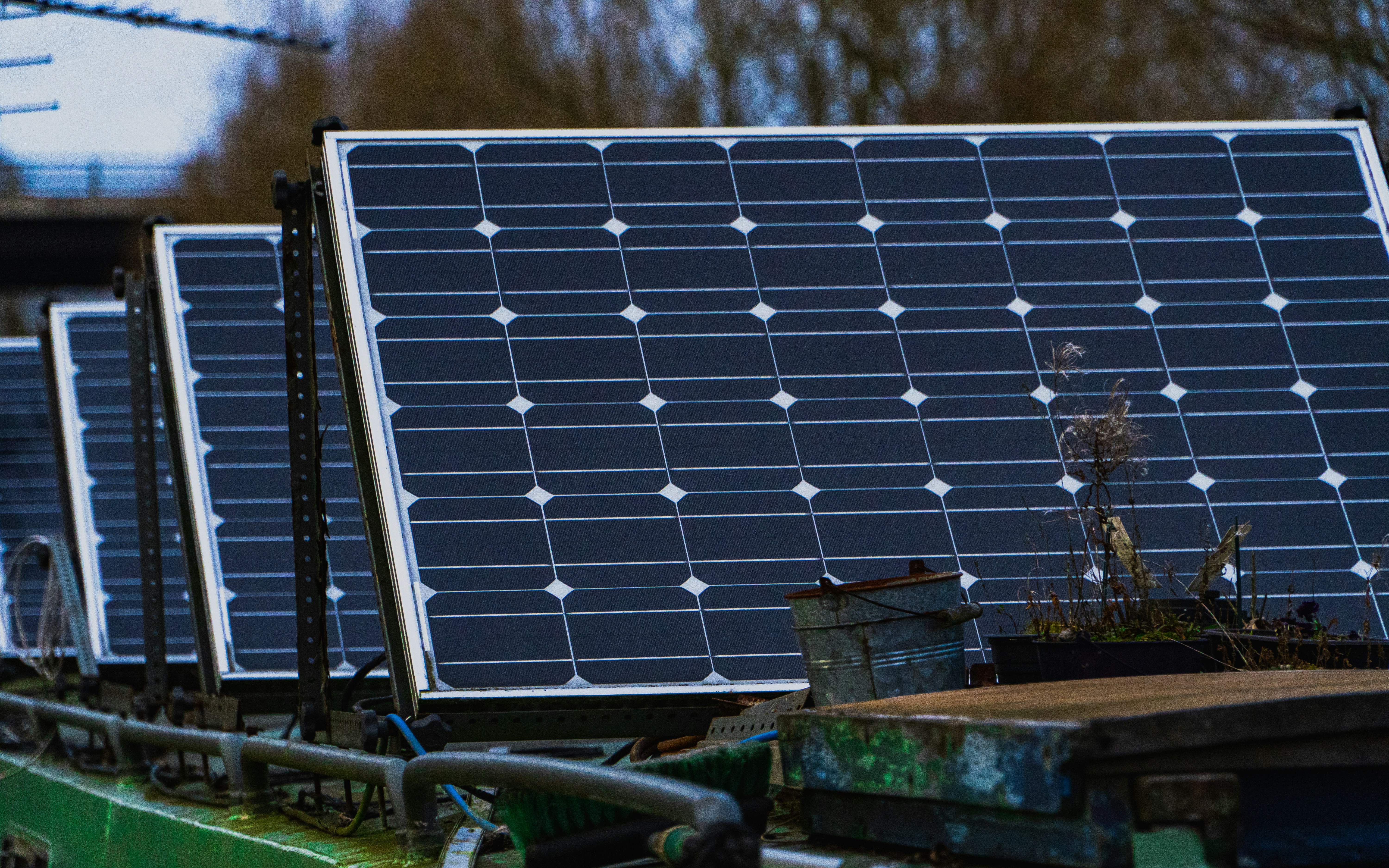 blue solar panels on brown wooden bench