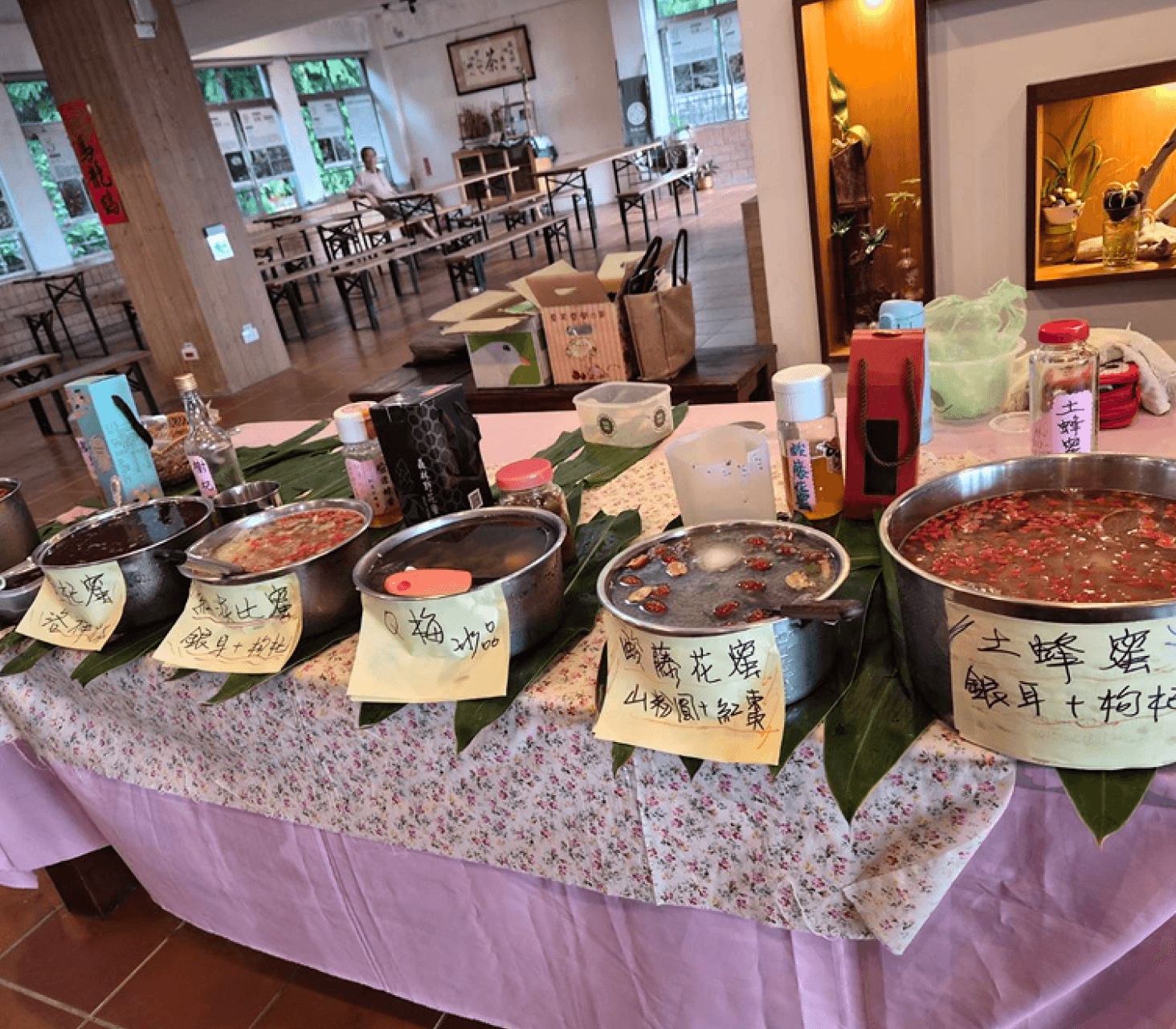 A man stading with Surfboard