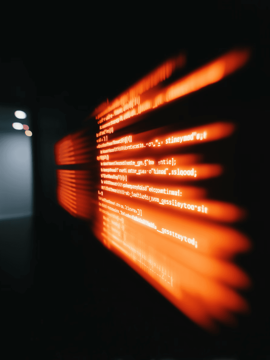 Code lines on a screen, orange.