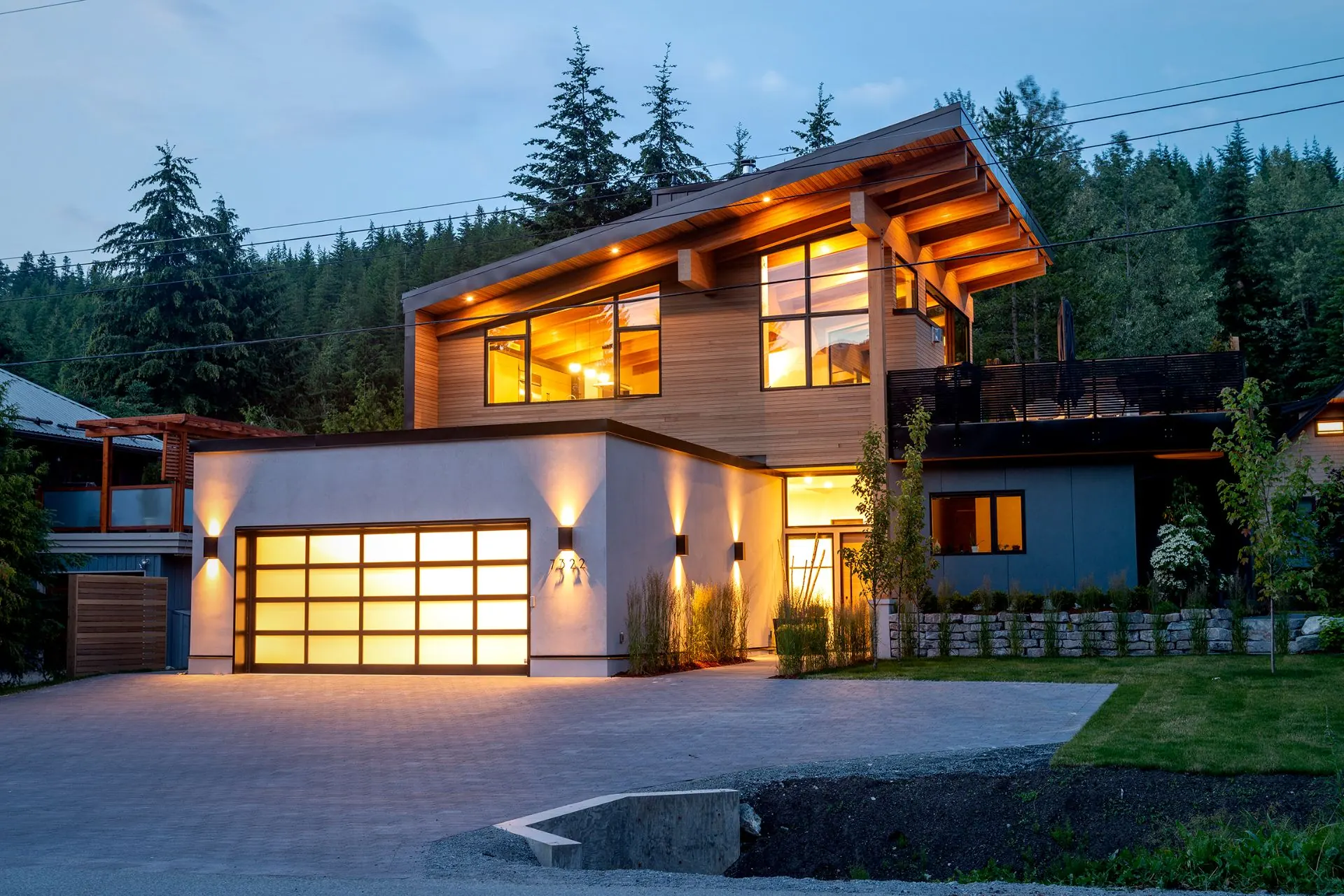 Soleil Residence in Whistler at dusk, highlighting timber craftsmanship and solar-efficient design.