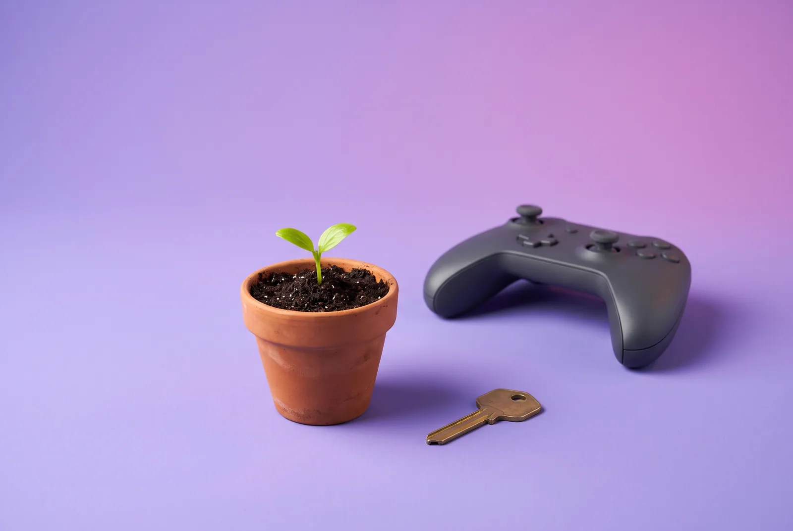 Teen recovery from porn concept: a small green sprout growing in a terracotta pot with a brass key lying beside it on a violet backdrop