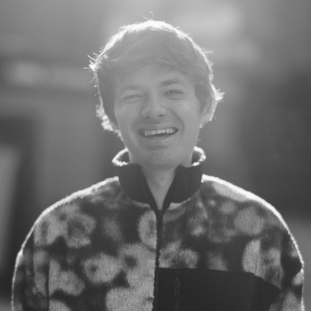 man greyscale smiling artist