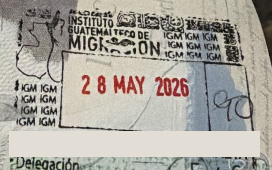 A Guatemalan immigration entry stamp dated 28 May 2026, with ninety days written into the box by hand.