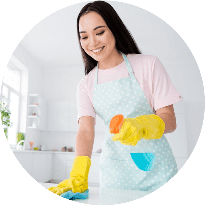 Justo Professional Cleaning Employee cleaning counter top