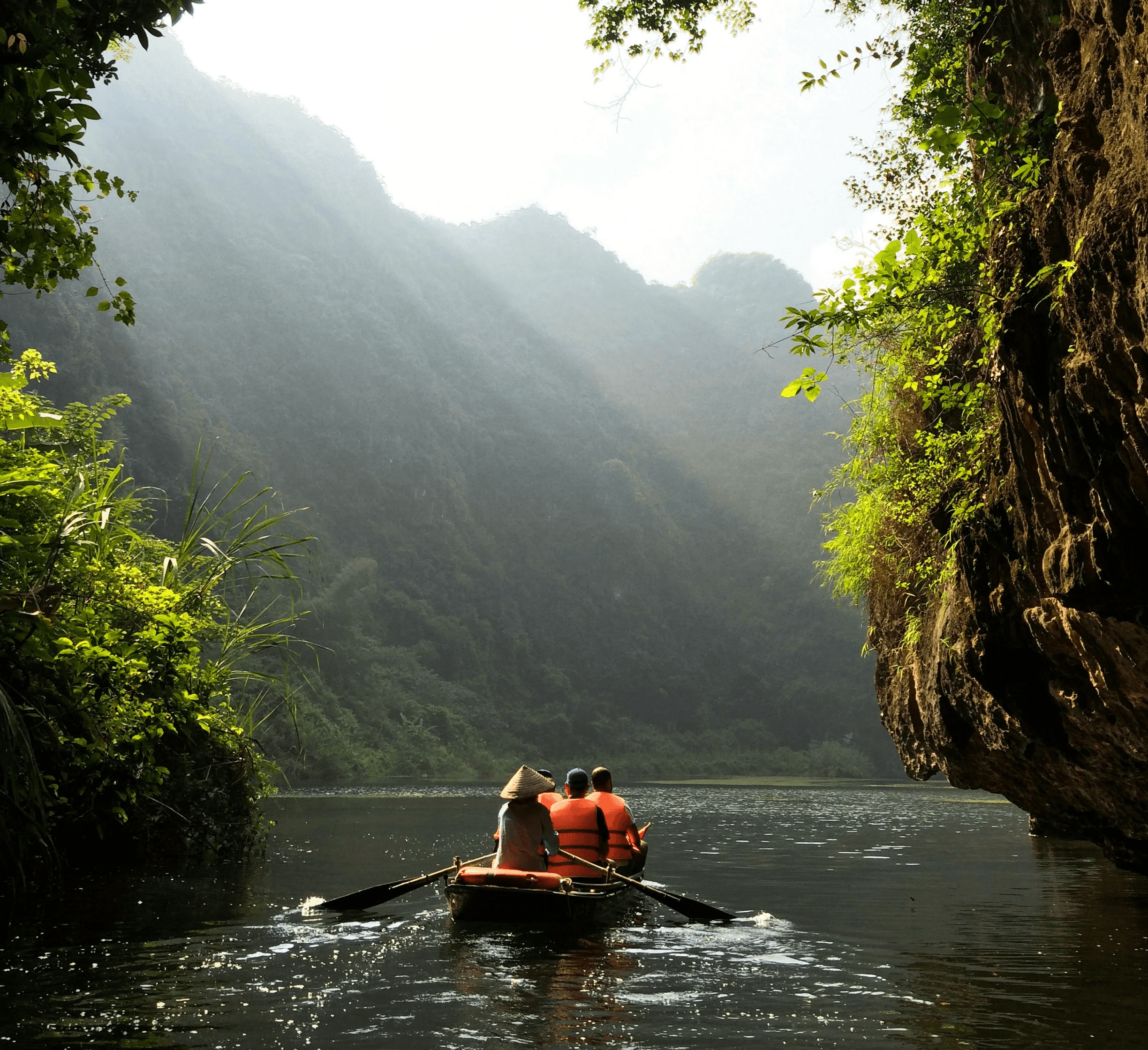 group of people on boat paddling during daytime