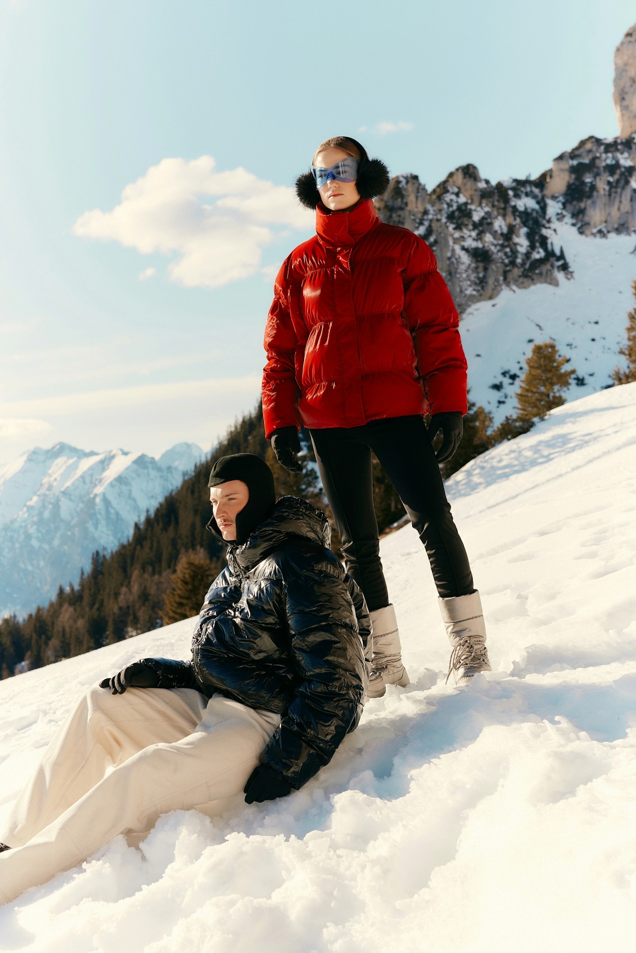 A couple on a snowy mountain.