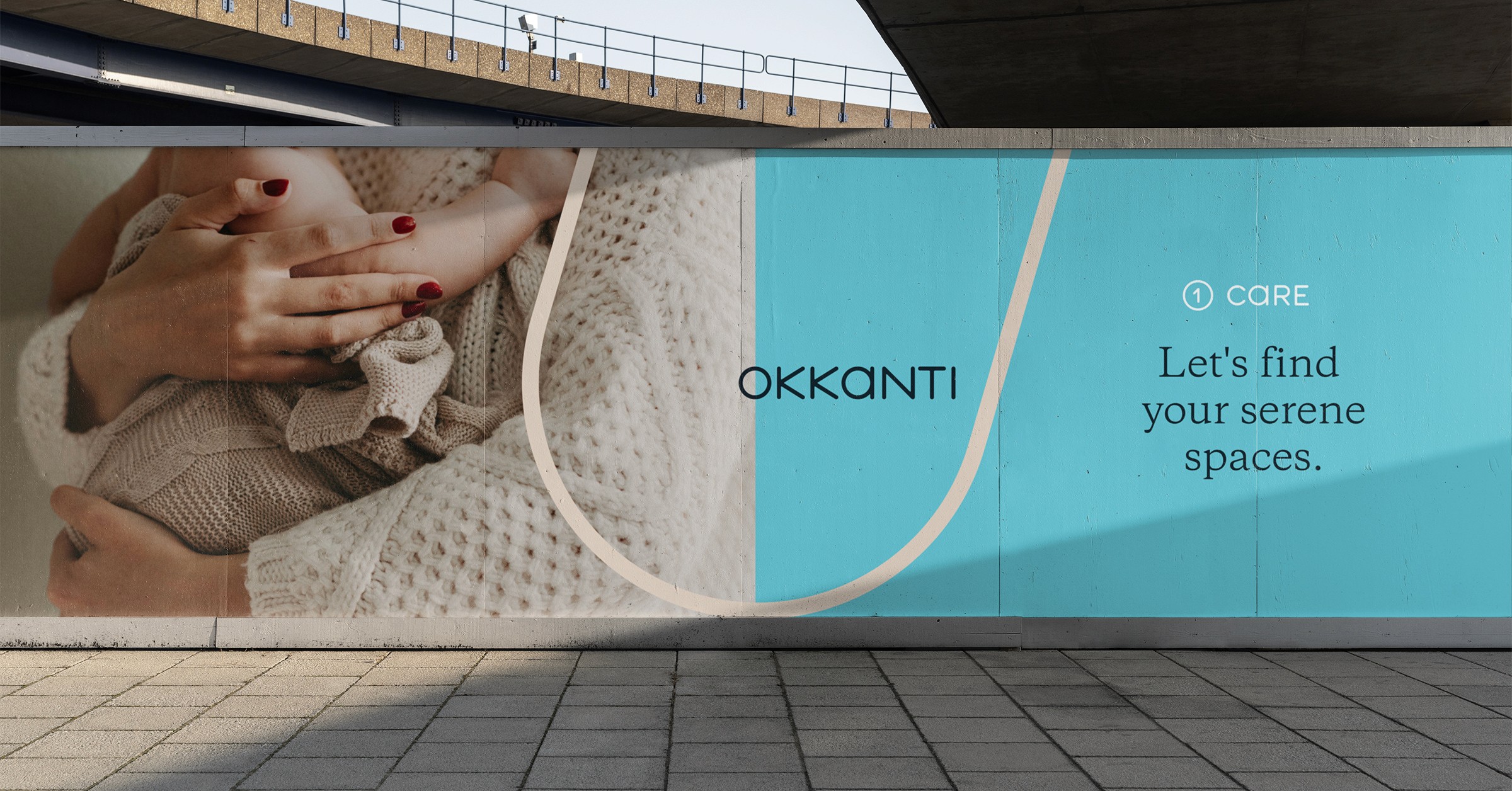 Okkanti long billboard under an overpass