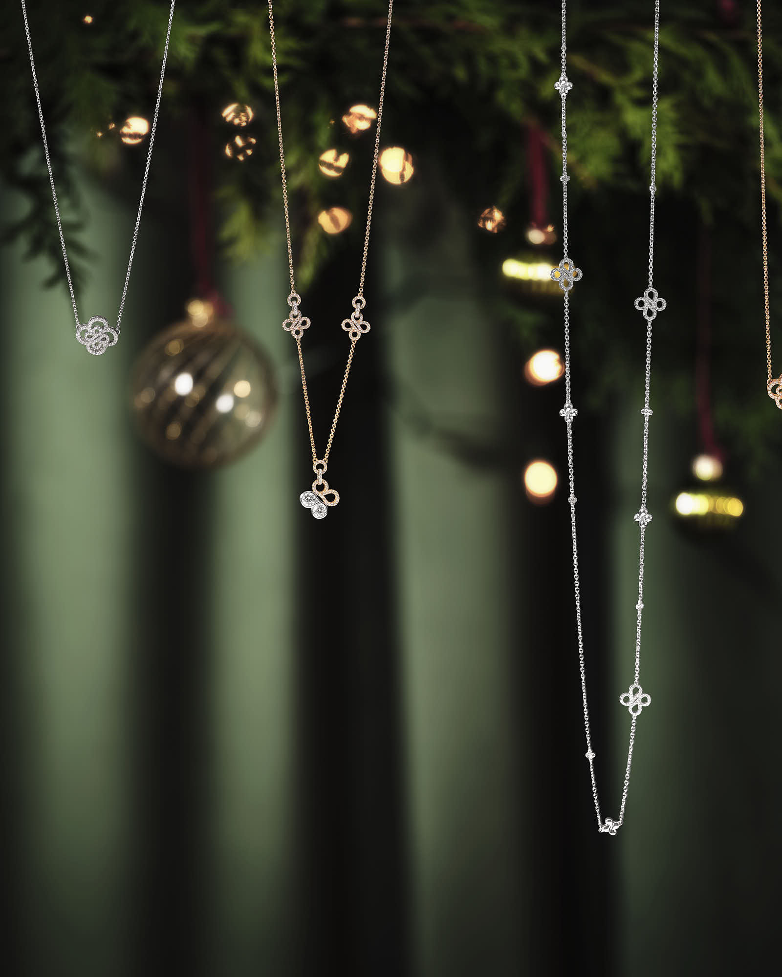 Hanging necklaces illuminate a dark background, casting soft light and shadows in an enchanting atmosphere.